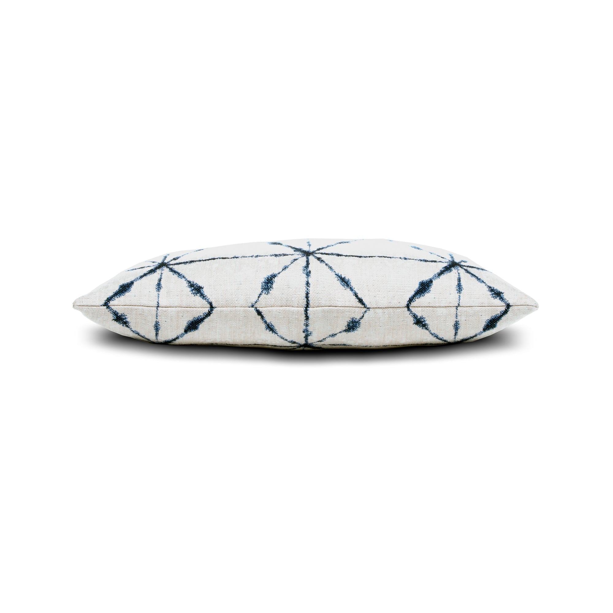 Side image of Ivory and indigo lattice pillow in lumbar size for stylish indoor and outdoor decor by Elaine Smith