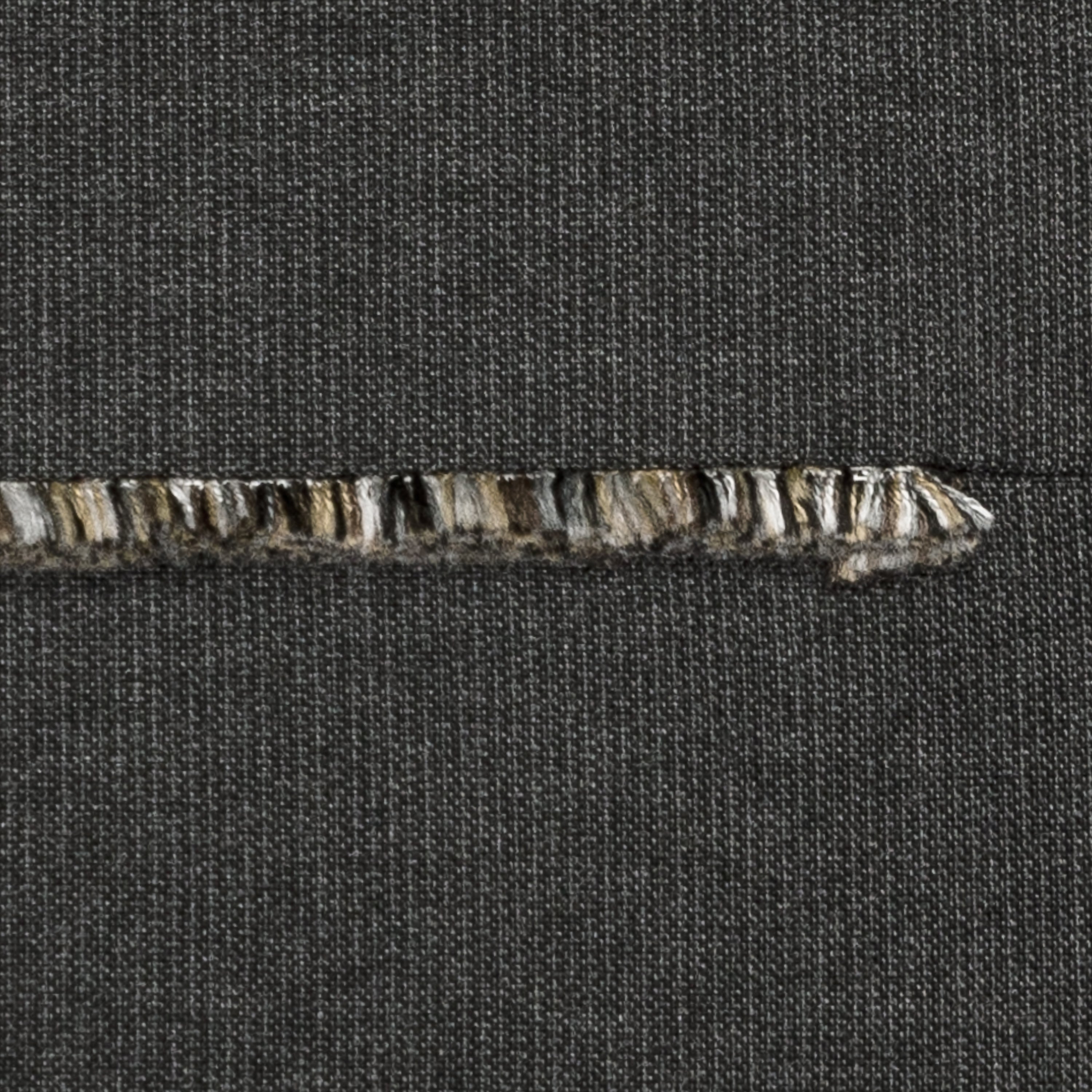 Detail image of Carbon black pillow with micro fringe details in square size for dramatic indoor and outdoor decor