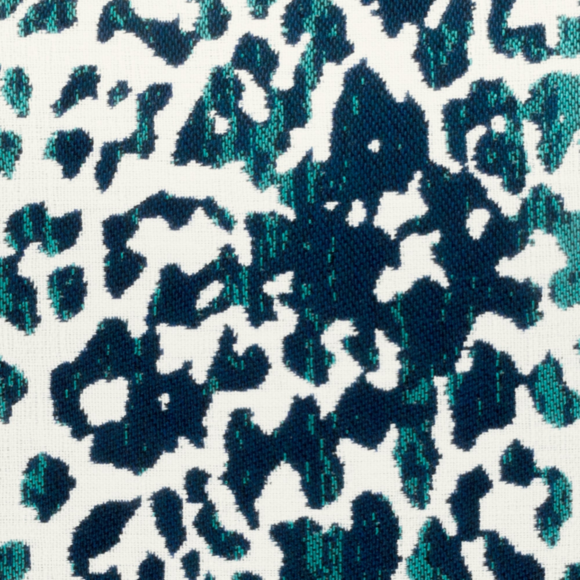 Detail image of Animal pattern in teal and dark blue pillow in square size for indoor and outdoor décor.