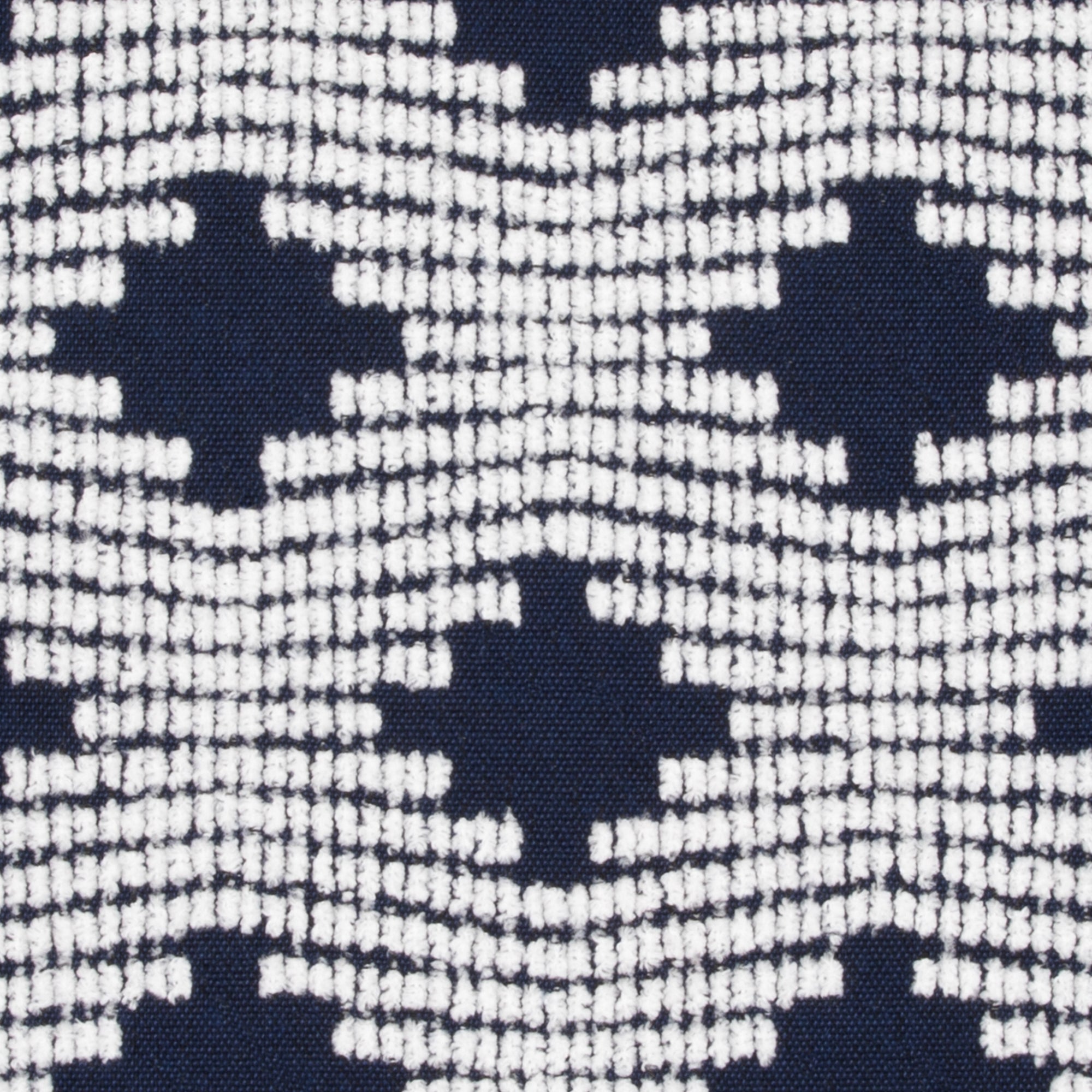 Detail image of Navy lattice pillow lumbar size for sophisticated indoor and outdoor decor