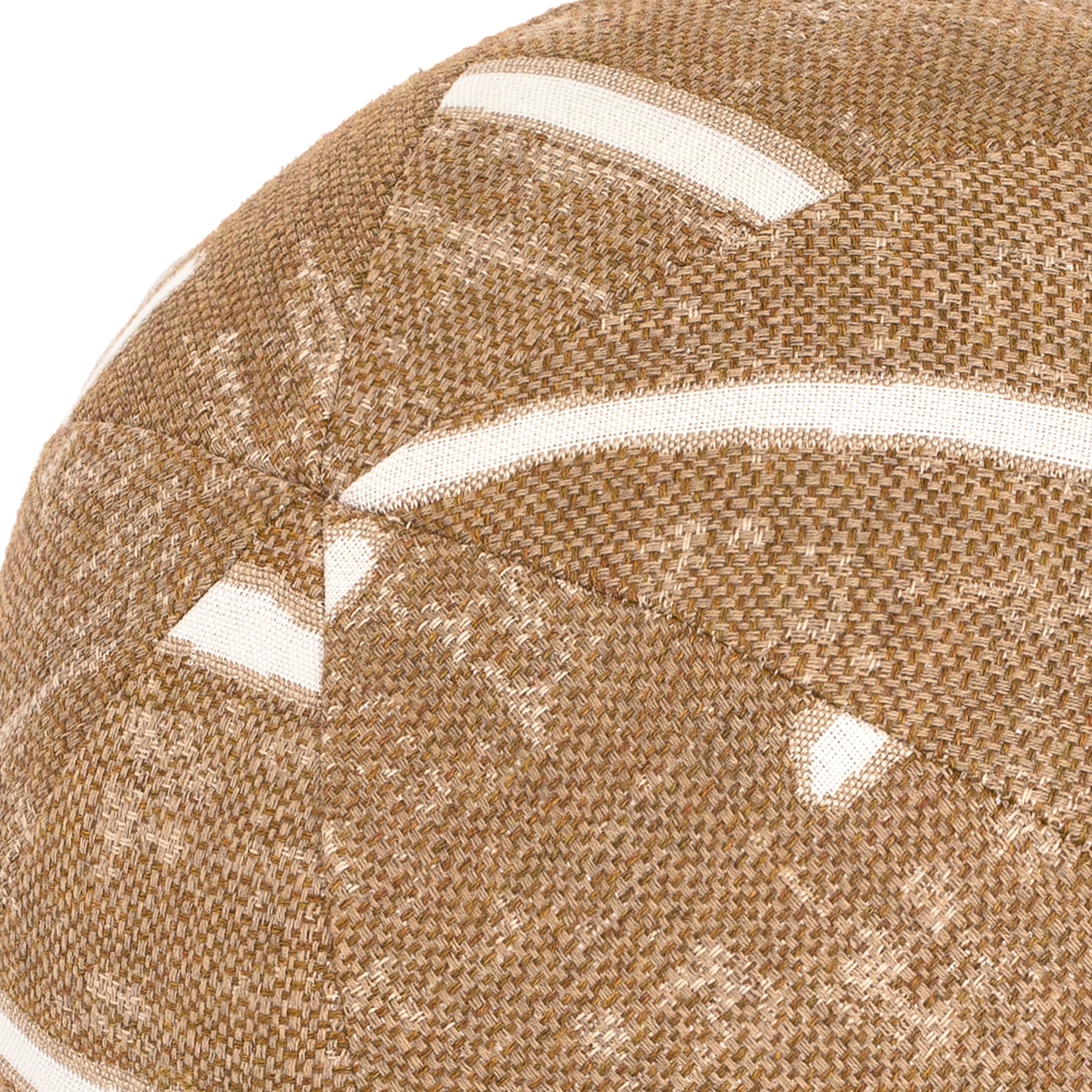 Detail image of Round brown outdoor pillow with textured finish for stylish patio decor
