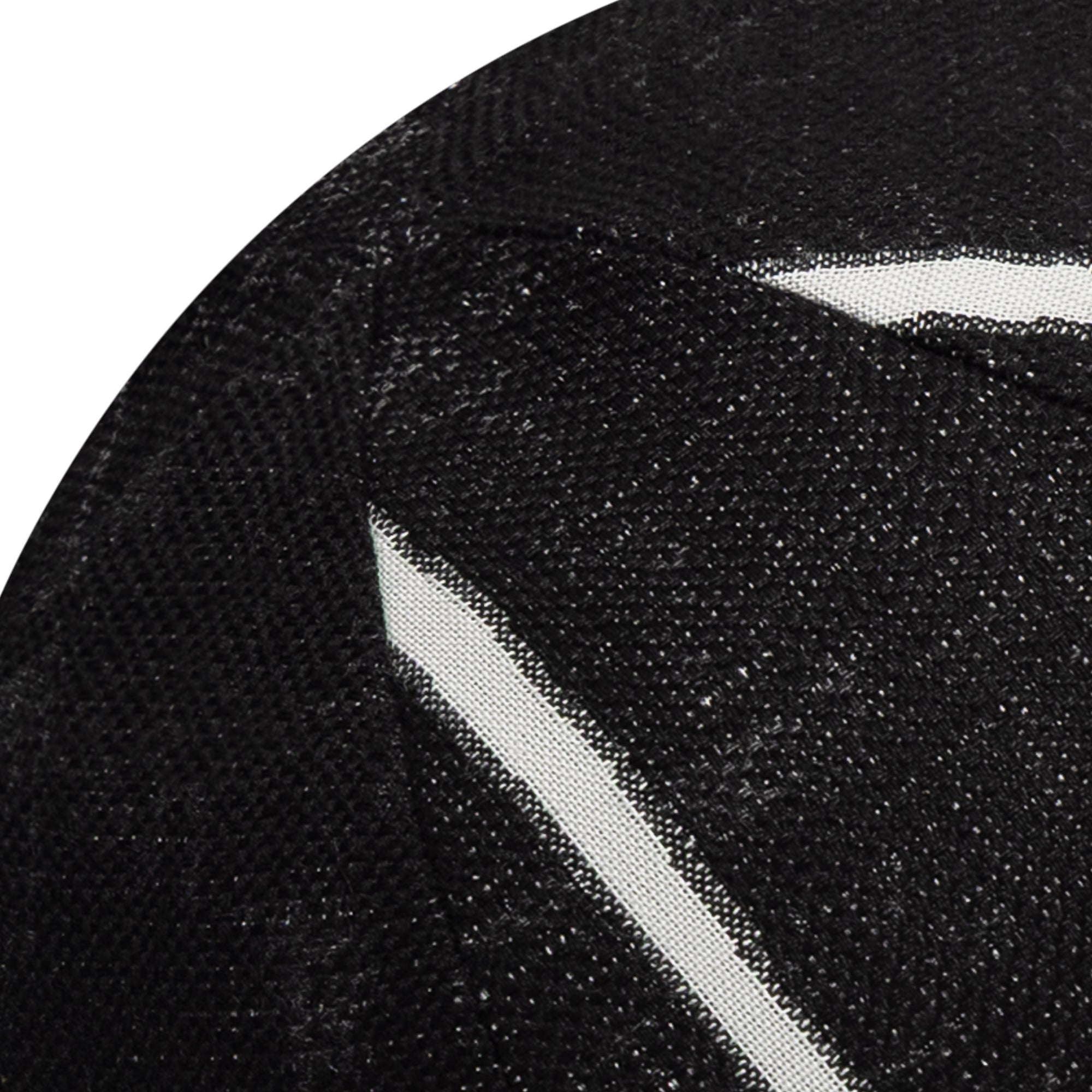 Detail image of Round black outdoor pillow with textured finish for elegant patio decor