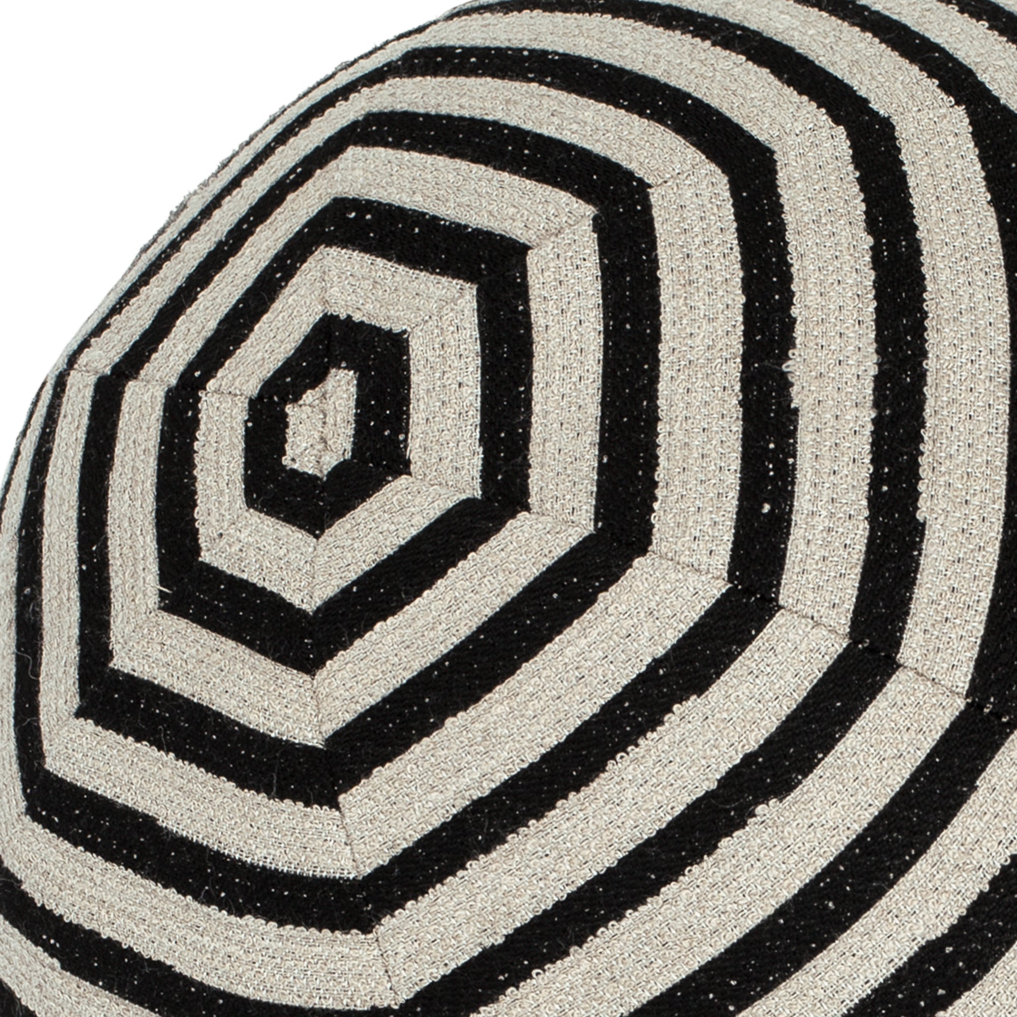 Detail image of Round black and ivory pillow with textured finish for bold indoor and outdoor decor