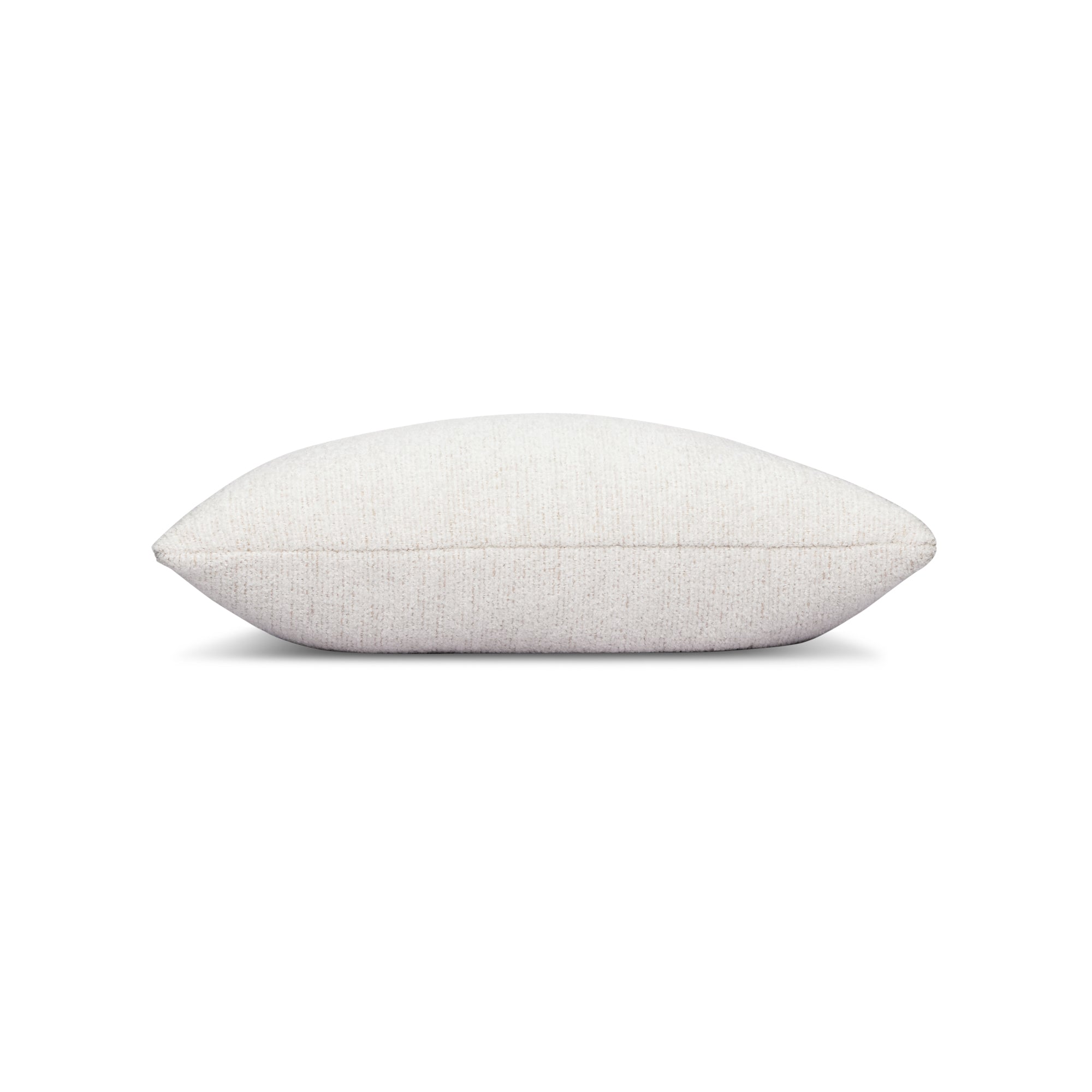 Side image of Ivory outdoor pillow with subtle weave, lumbar size for versatile outdoor seating