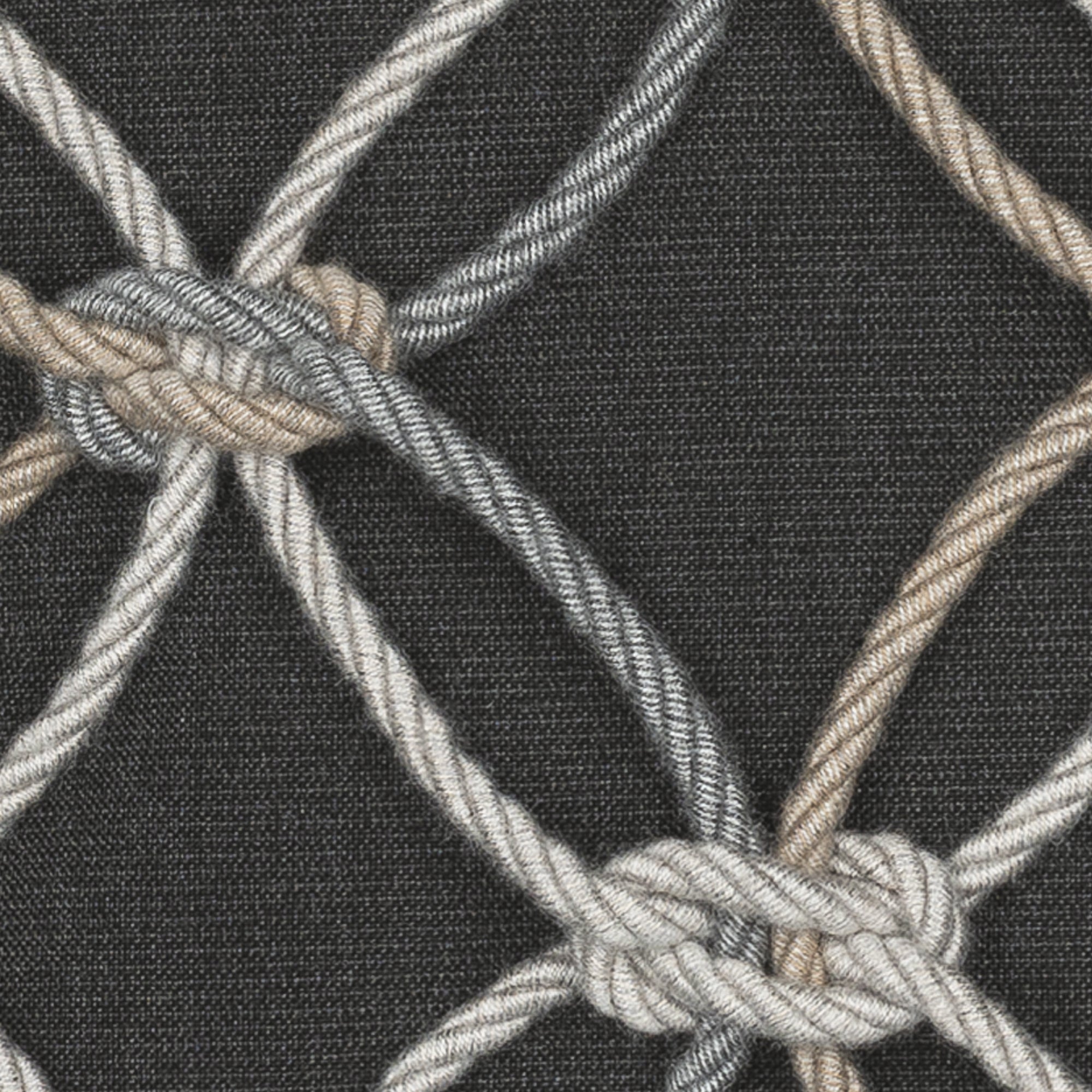 Detail image of Black outdoor pillow with diamond stitch pattern, lumbar size for elegant outdoor seating