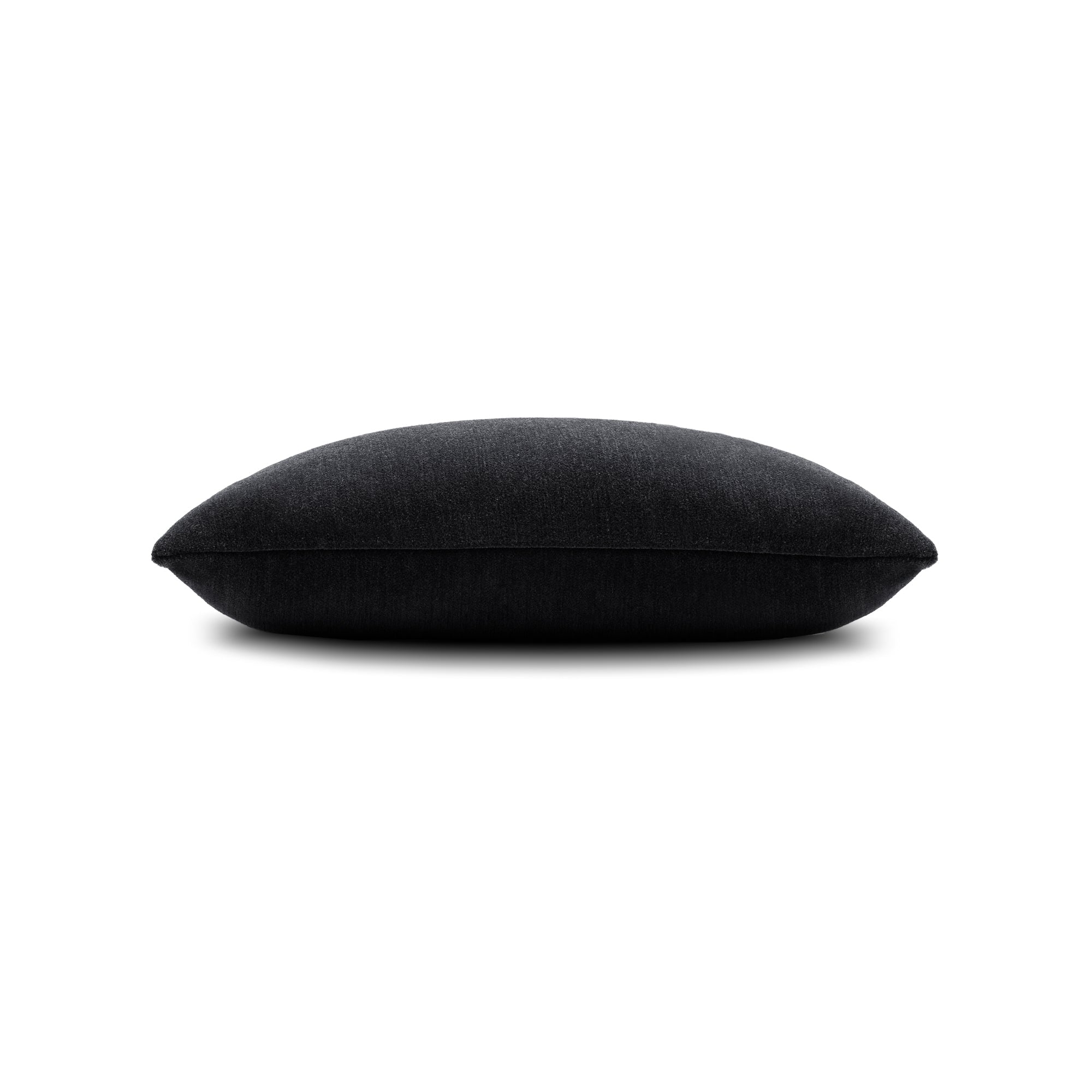 Side image of Charcoal velour outdoor pillow lumbar size for timeless indoor and outdoor decor