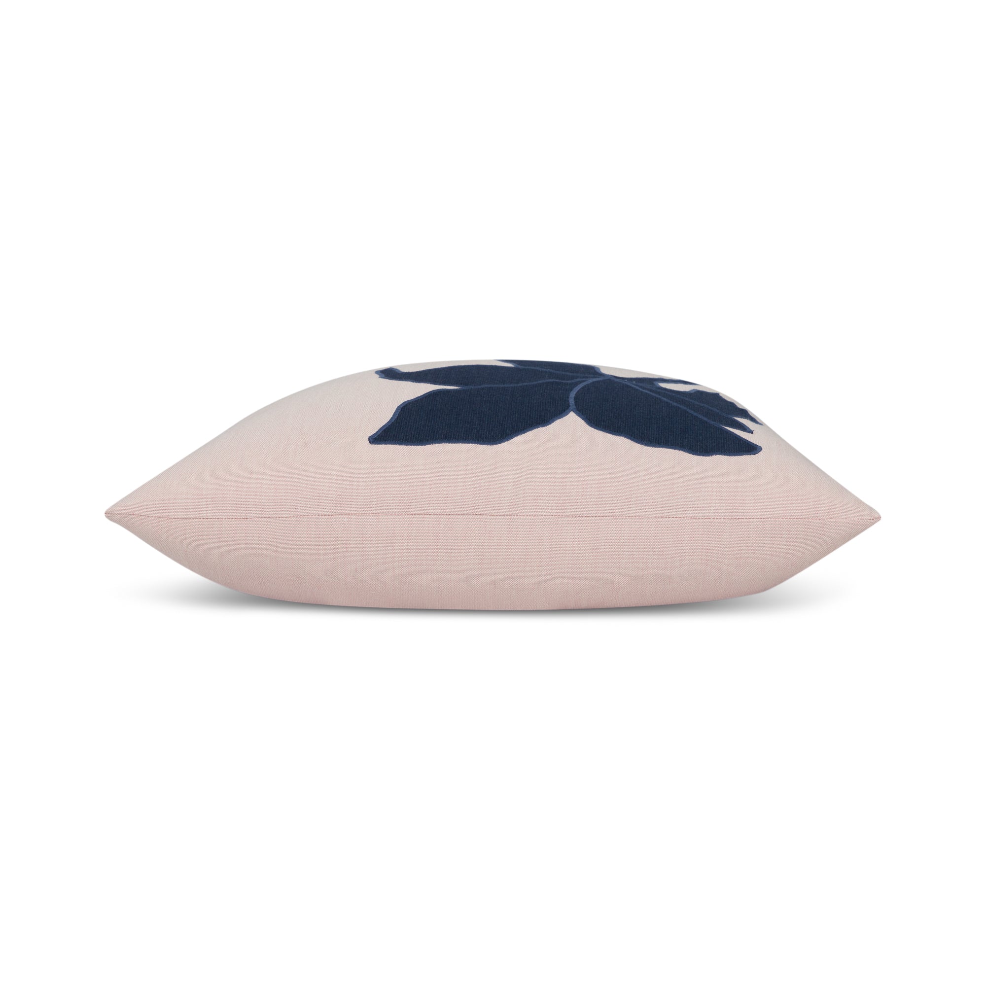 Side image of Blush pink outdoor pillow with navy floral design for elegant patio styling