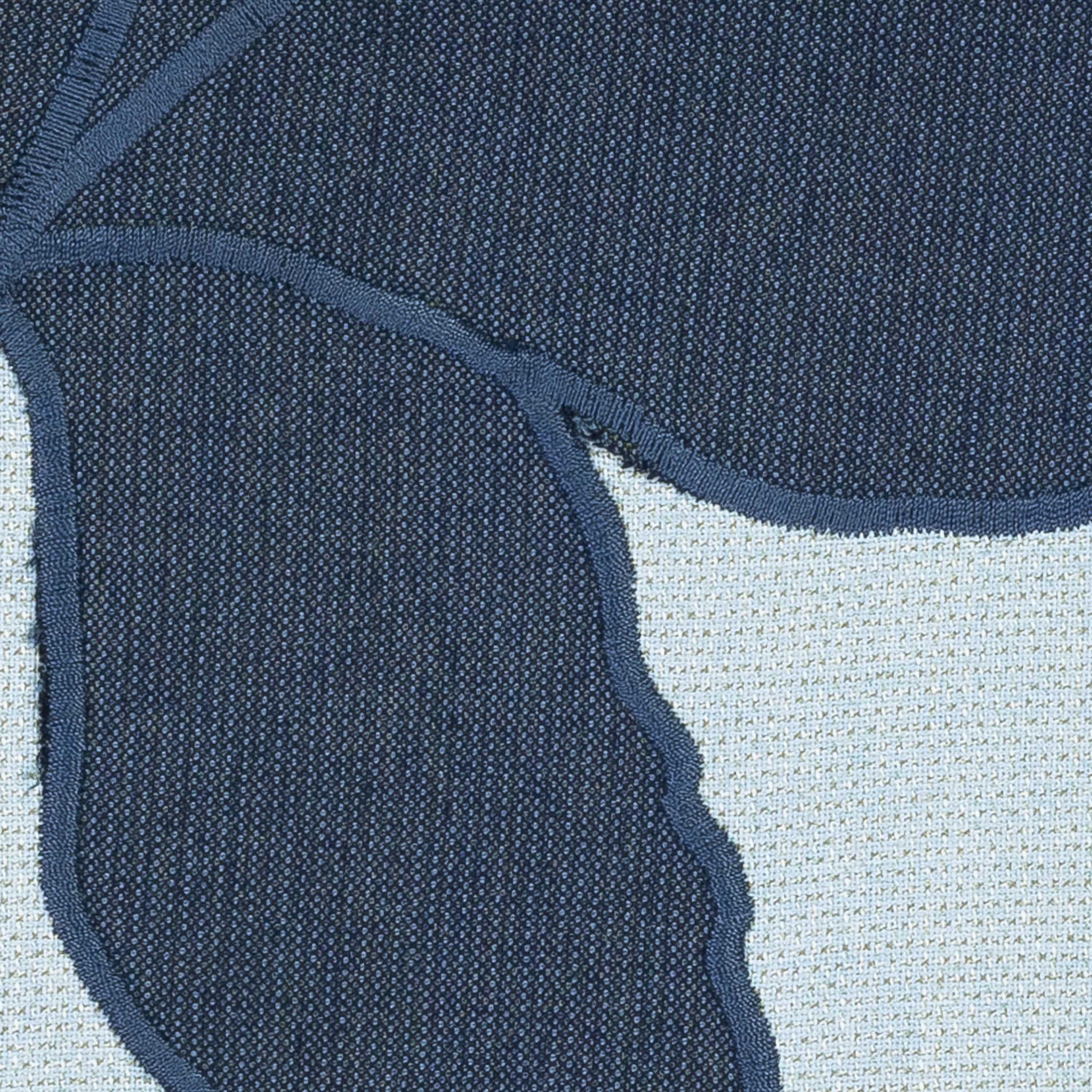 Detail image of Navy outdoor pillow with oversized floral print for luxury outdoor seating by Elaine Smith