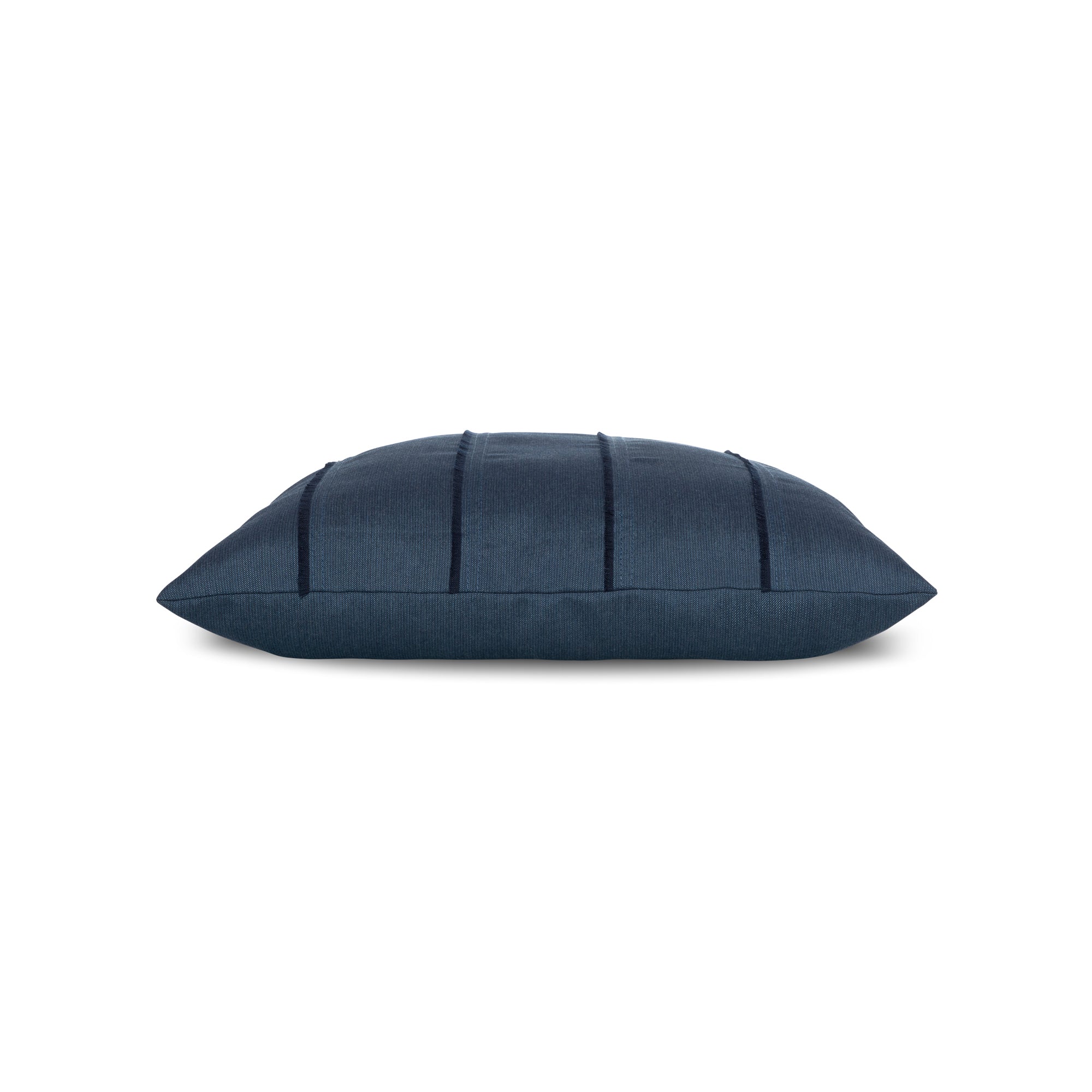 Side image of Indigo solid pillow with fringe detailing lumbar size for coastal indoor and outdoor decor