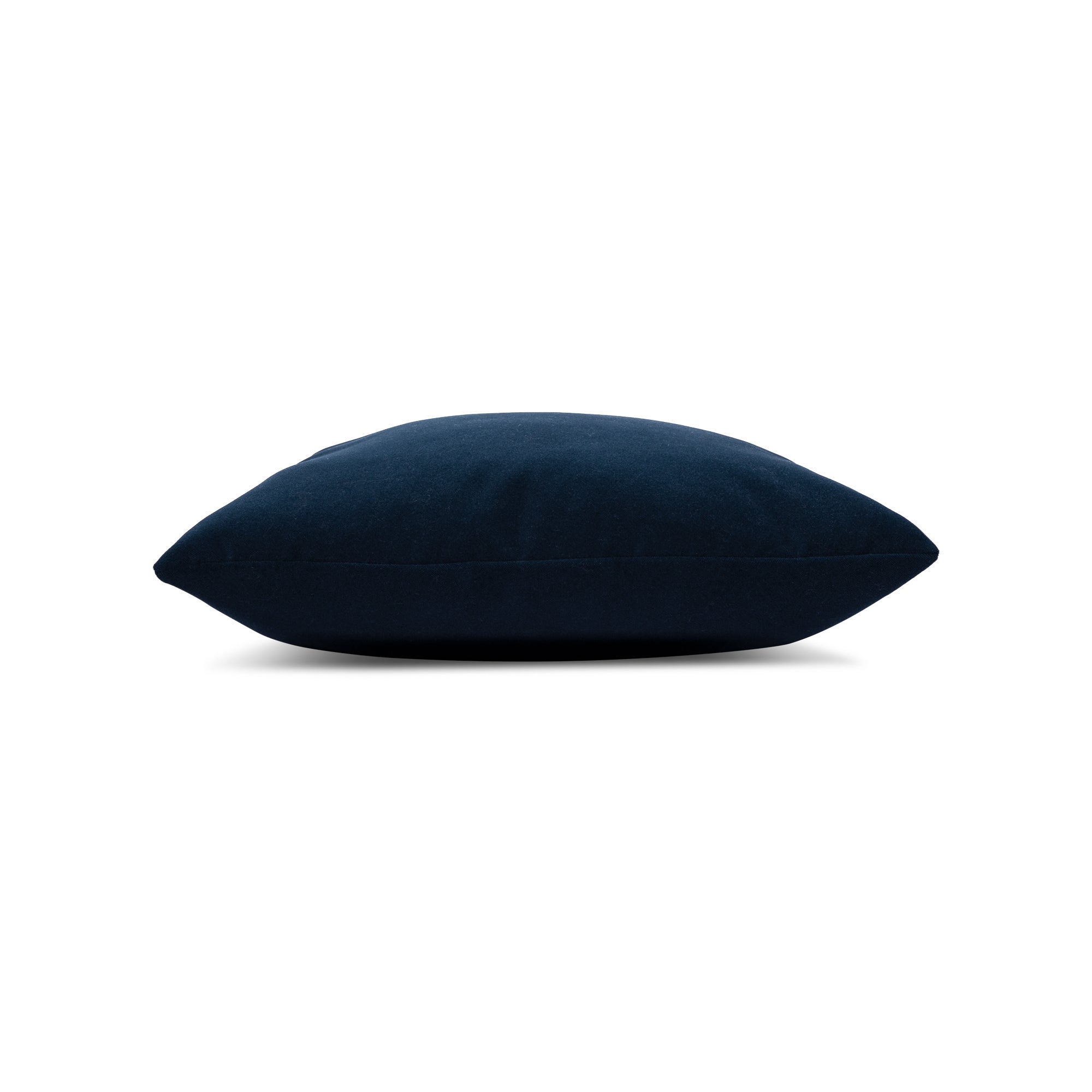 Side image of Navy solid velvet pillow lumbar size for sophisticated patio decor