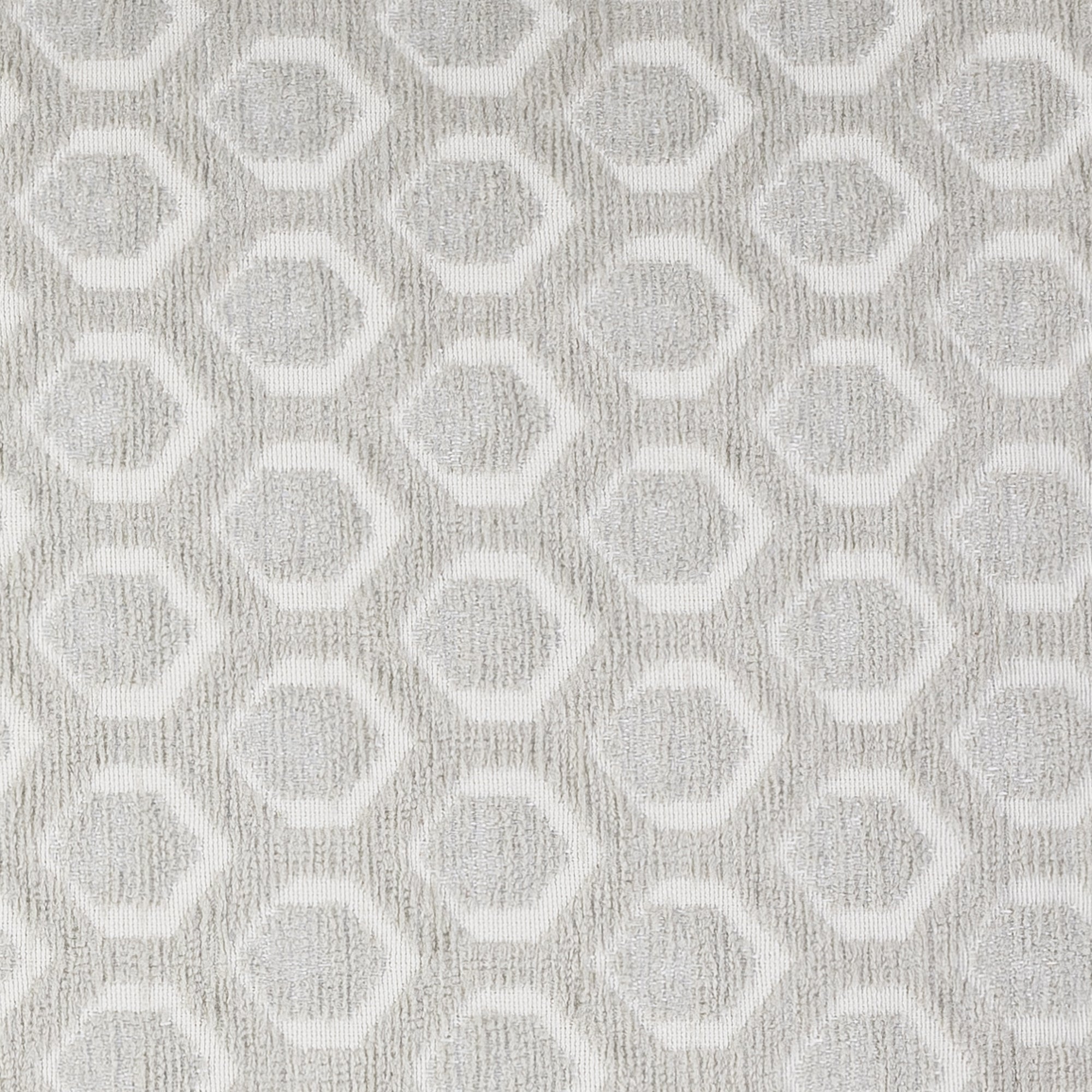 Detail image of Taupe outdoor pillow with solid texture lumbar size for bold patio decor by Elaine Smith