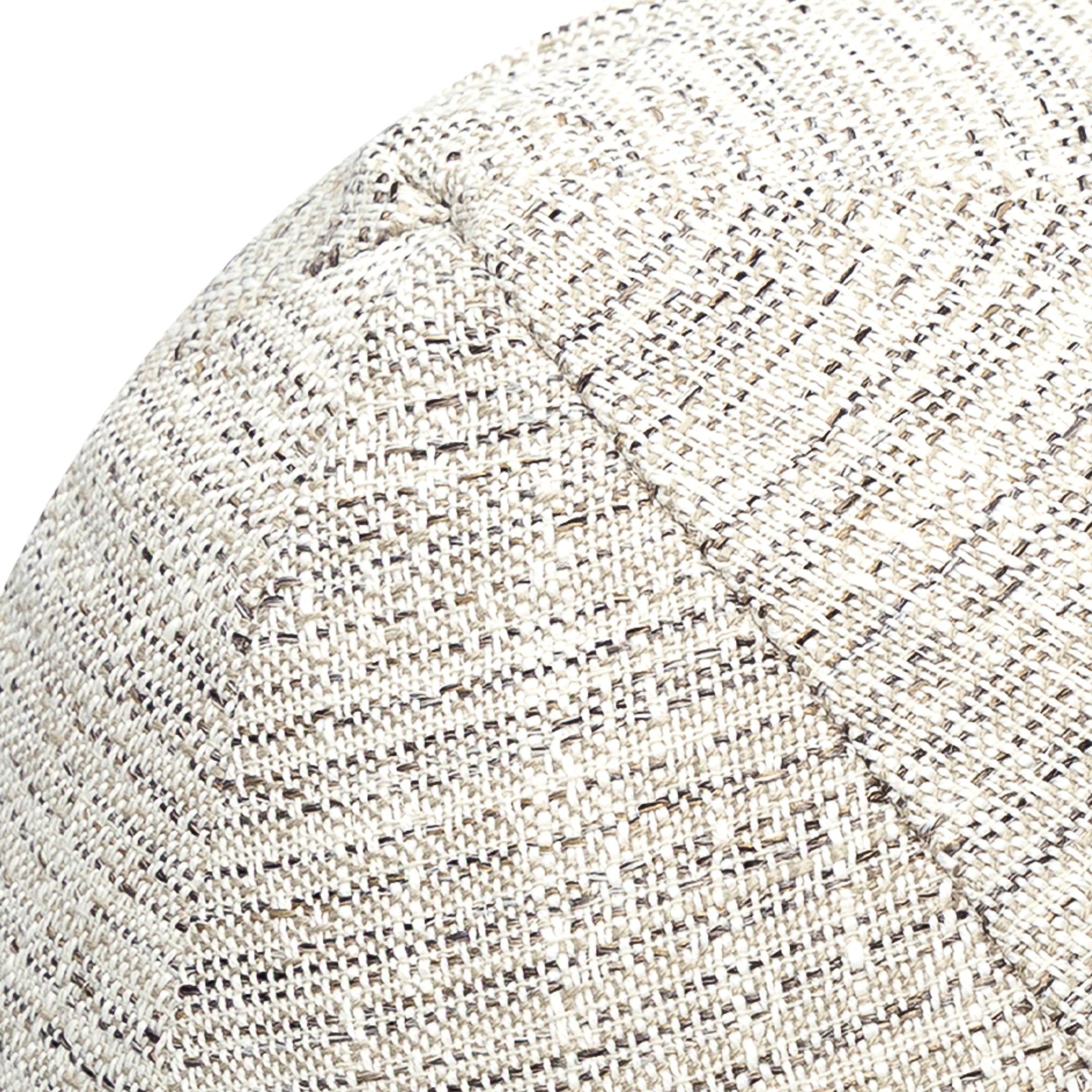 Detail image of Round ivory and black outdoor pillow with textured finish for stylish patio accents