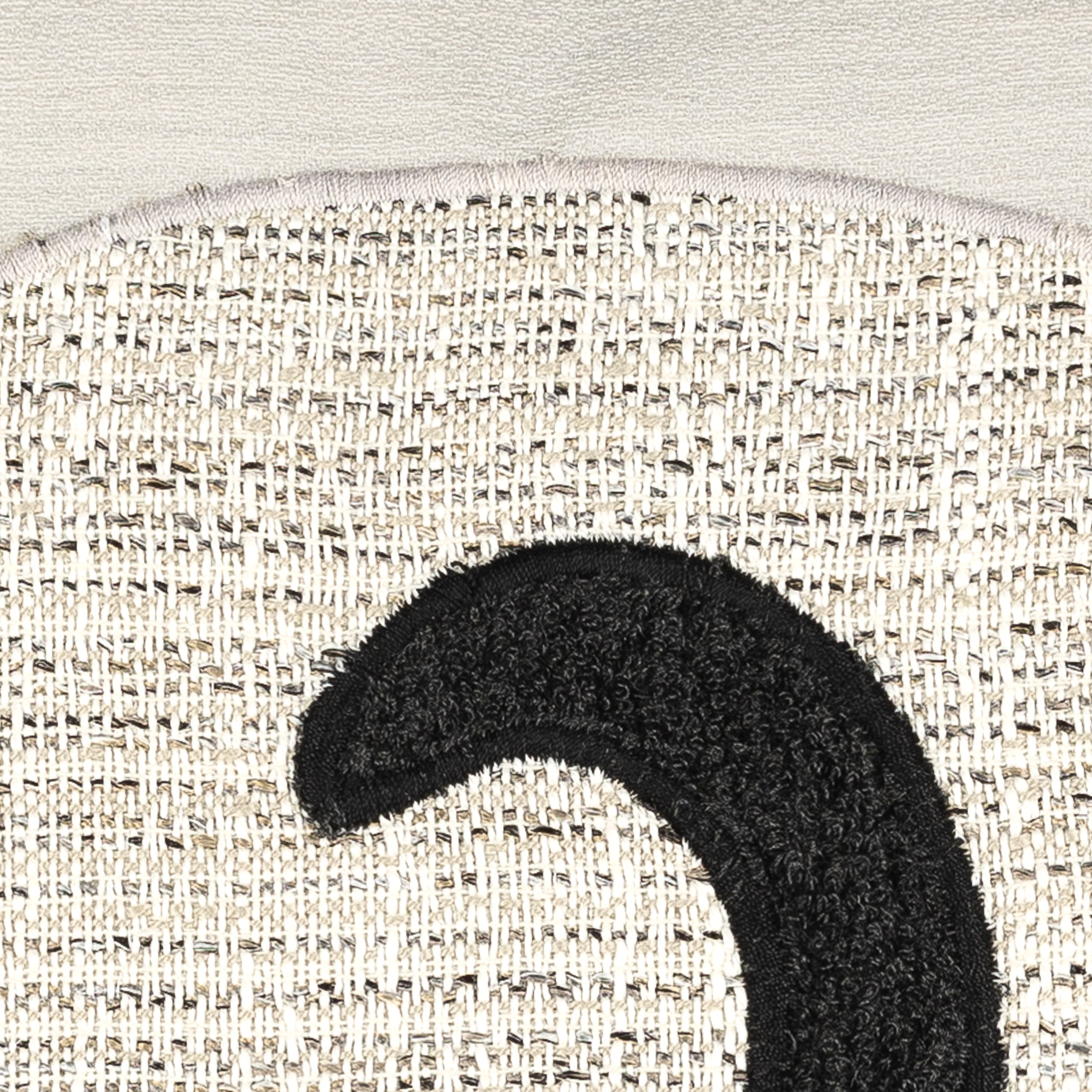 Detail image of Ivory cat motif pillow lumbar size for chic indoor and outdoor decor