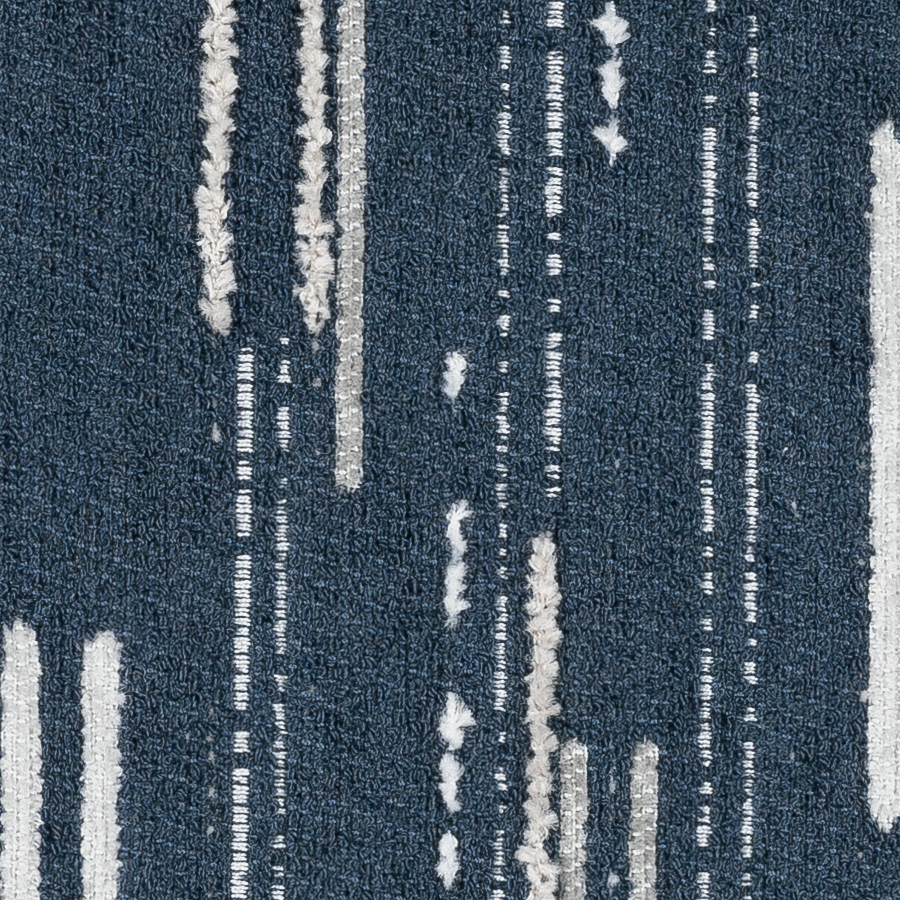 Detail image of Navy outdoor pillow with vertical stripe pattern, lumbar size for sophisticated outdoor seating