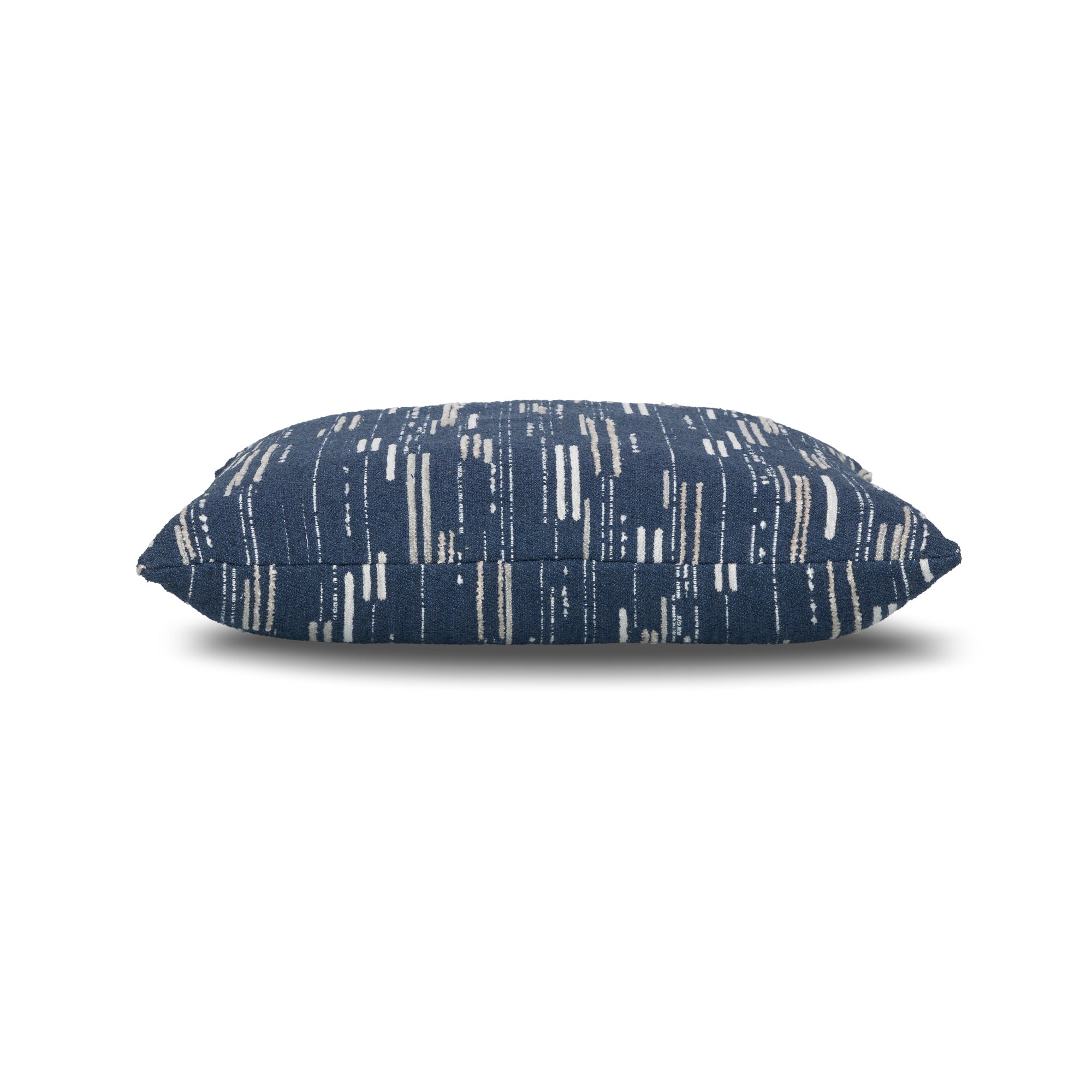 Side image of Navy outdoor pillow with vertical stripe pattern, lumbar size for sophisticated outdoor seating