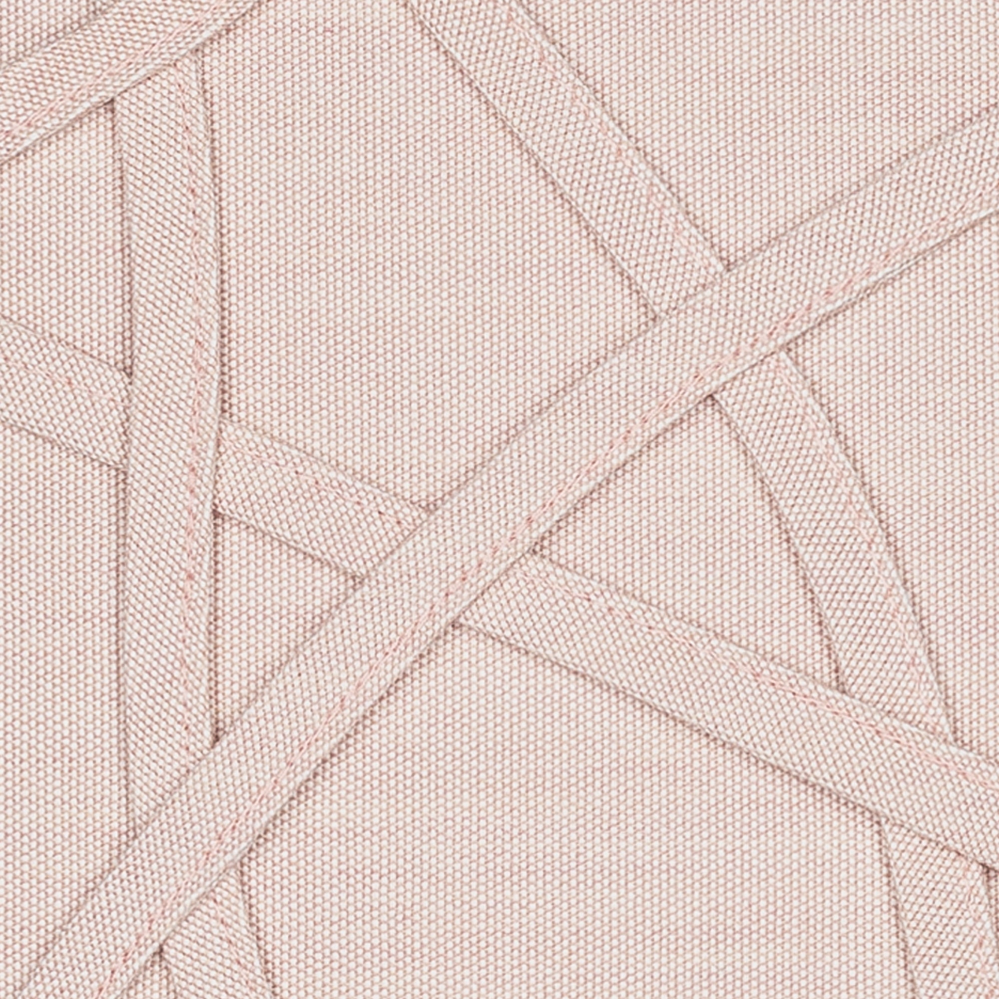 Detail image of Soft pink outdoor pillow with solid texture lumbar size for earthy patio décor