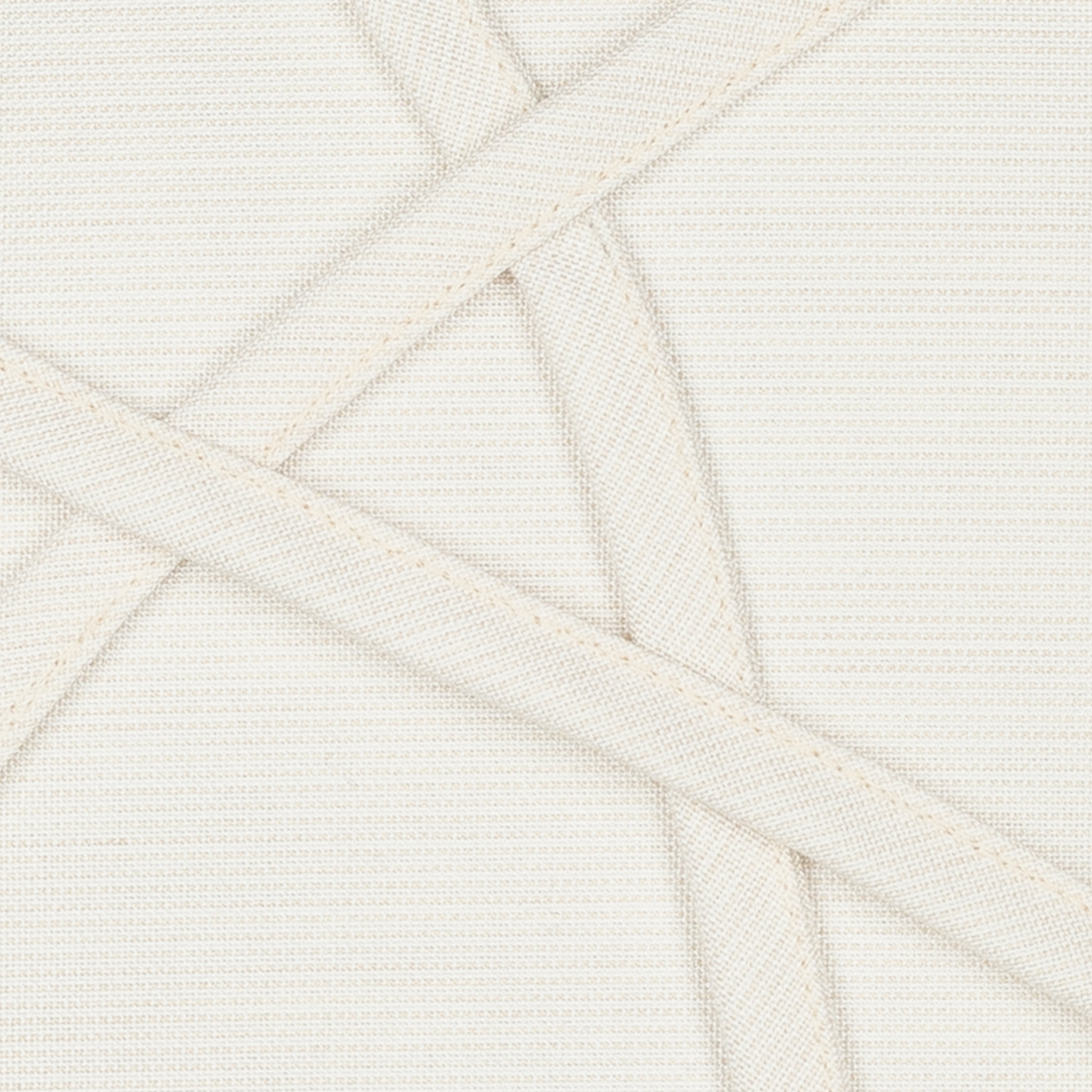 Detail image of Ivory outdoor pillow with solid texture lumbar size for sophisticated patio decor