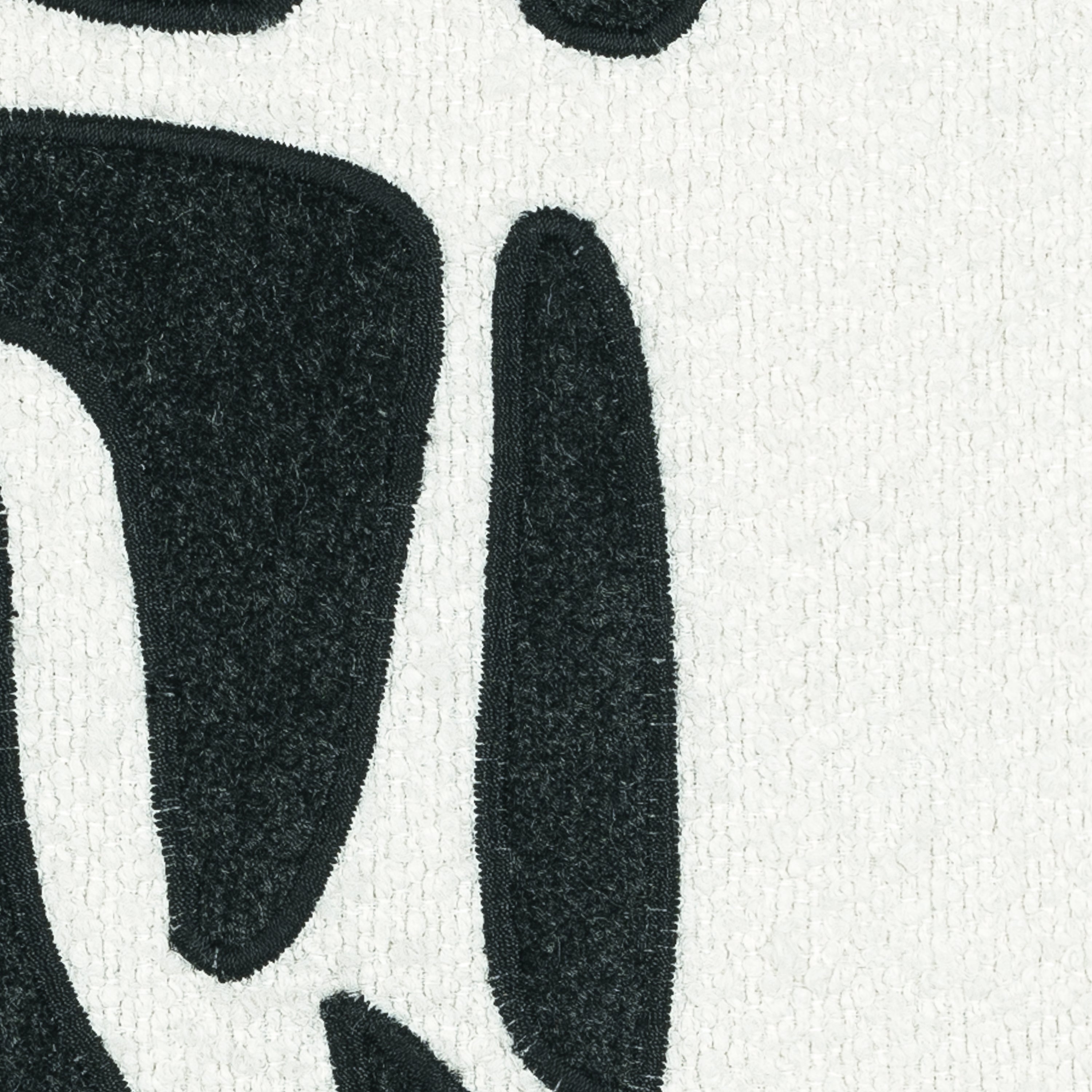 Detail image of Ivory textured pillow with charcoal velour details in square size for artistic indoor and outdoor decor