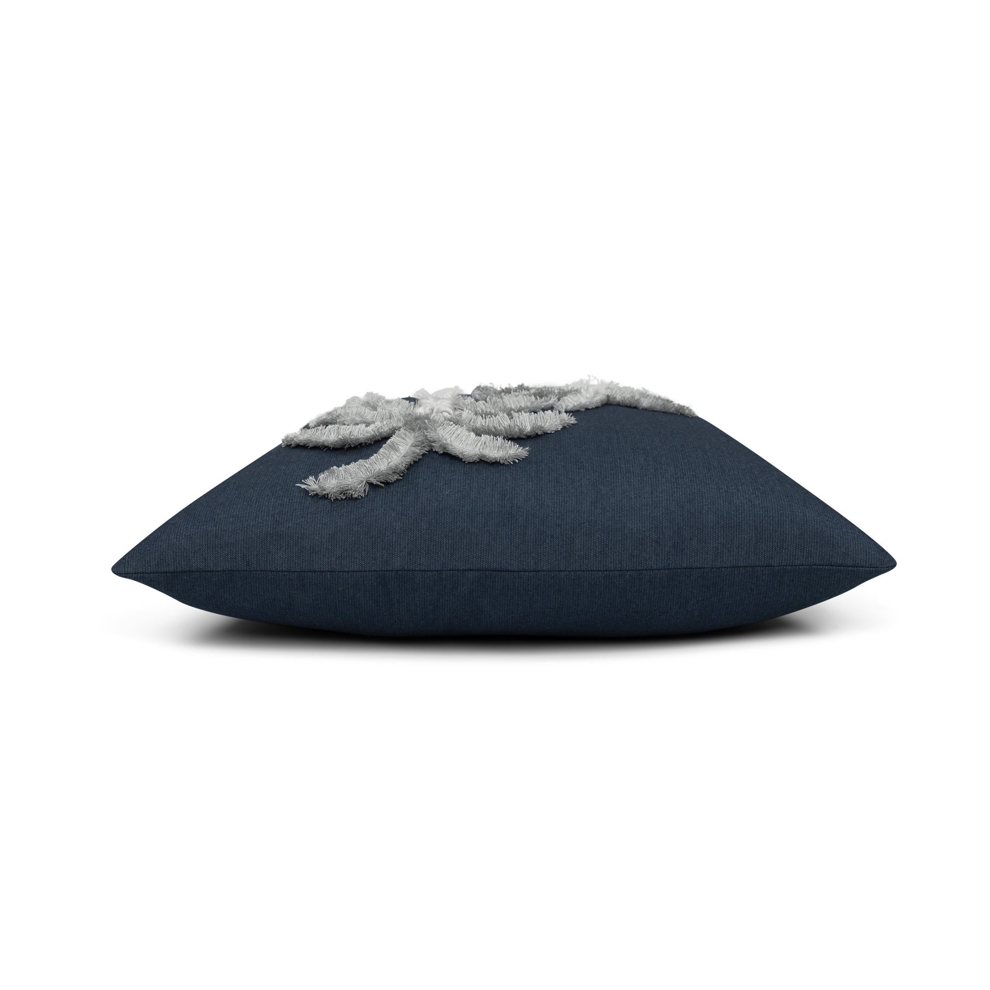 Side image of Indigo outdoor pillow with palm leaf pattern square size for coastal patio decor by Elaine Smith