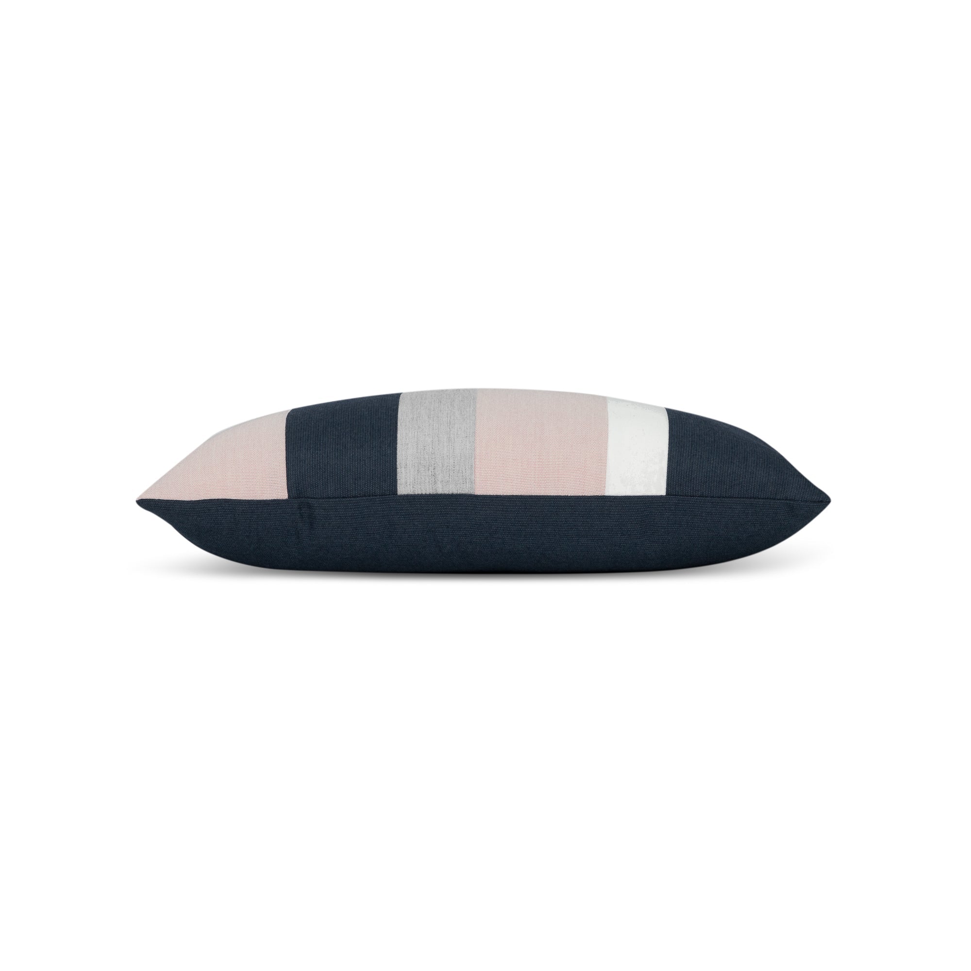 Side image of Blush pink, indigo and gray striped pillow in lumbar size for soft indoor and outdoor decor