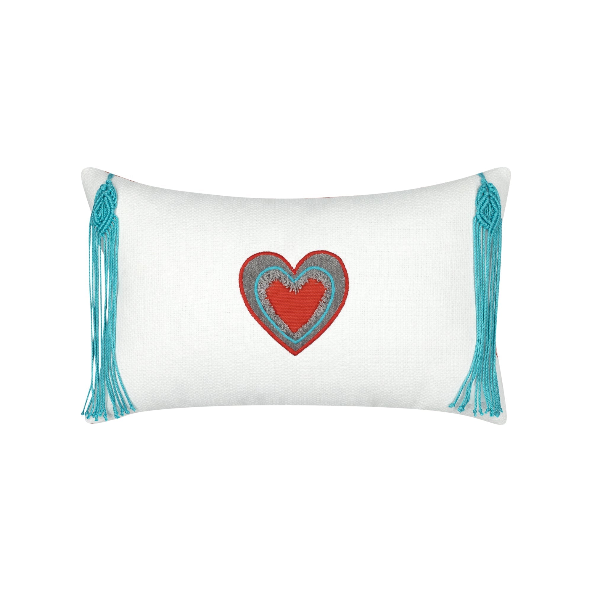 White pillow with cut out heart in red and gray and aruba tassels in western theme.