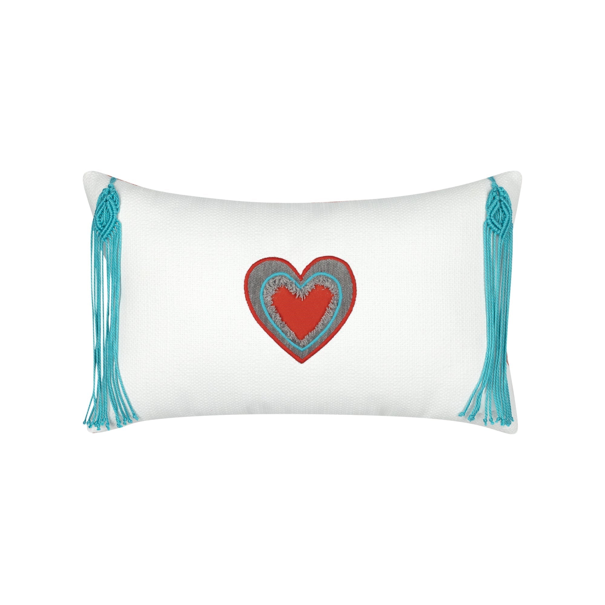 White pillow with cut out heart in red and gray and aruba tassels in western theme.