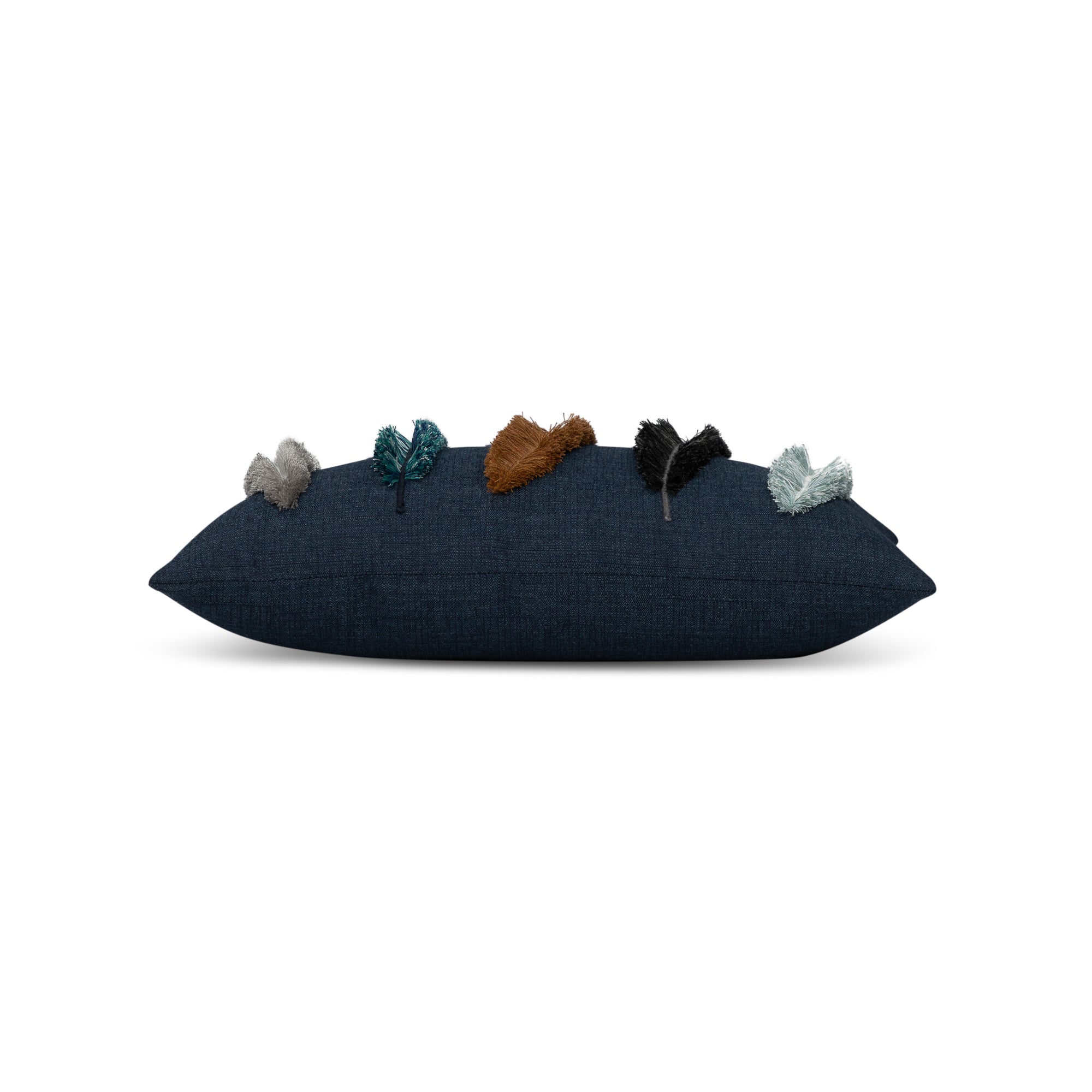 Side image of Outdoor lumbar pillow in denim with appliqued leaf pattern for coordinated outdoor decor