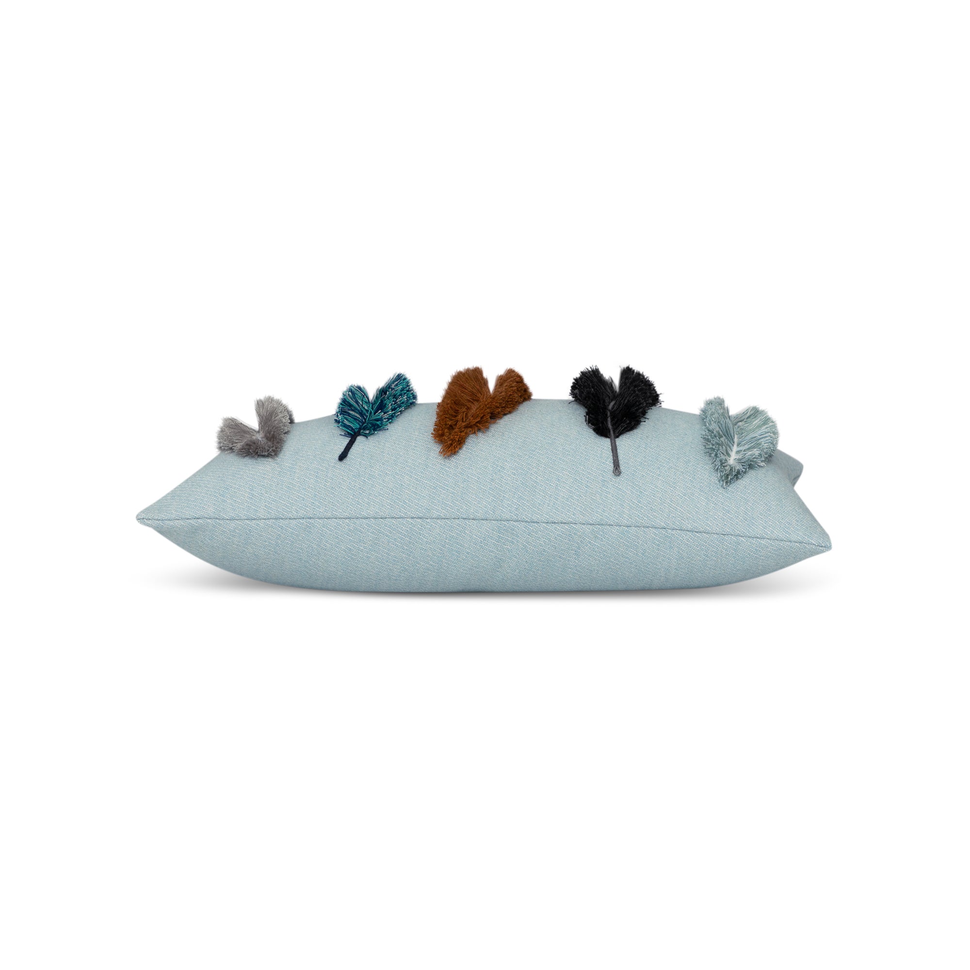 Side image of Outdoor lumbar pillow in light blue with appliqued leaf pattern for coordinated outdoor decor