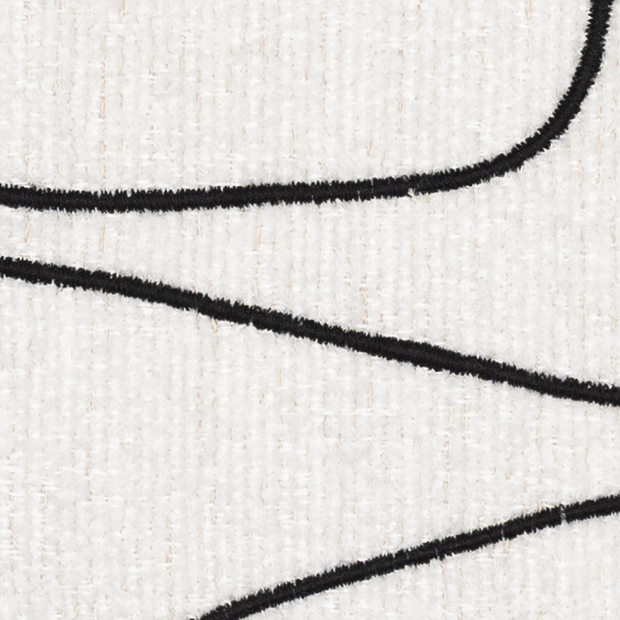 Detail image of Ebony abstract stitched design on ivory outdoor pillow square size for artistic patio decor