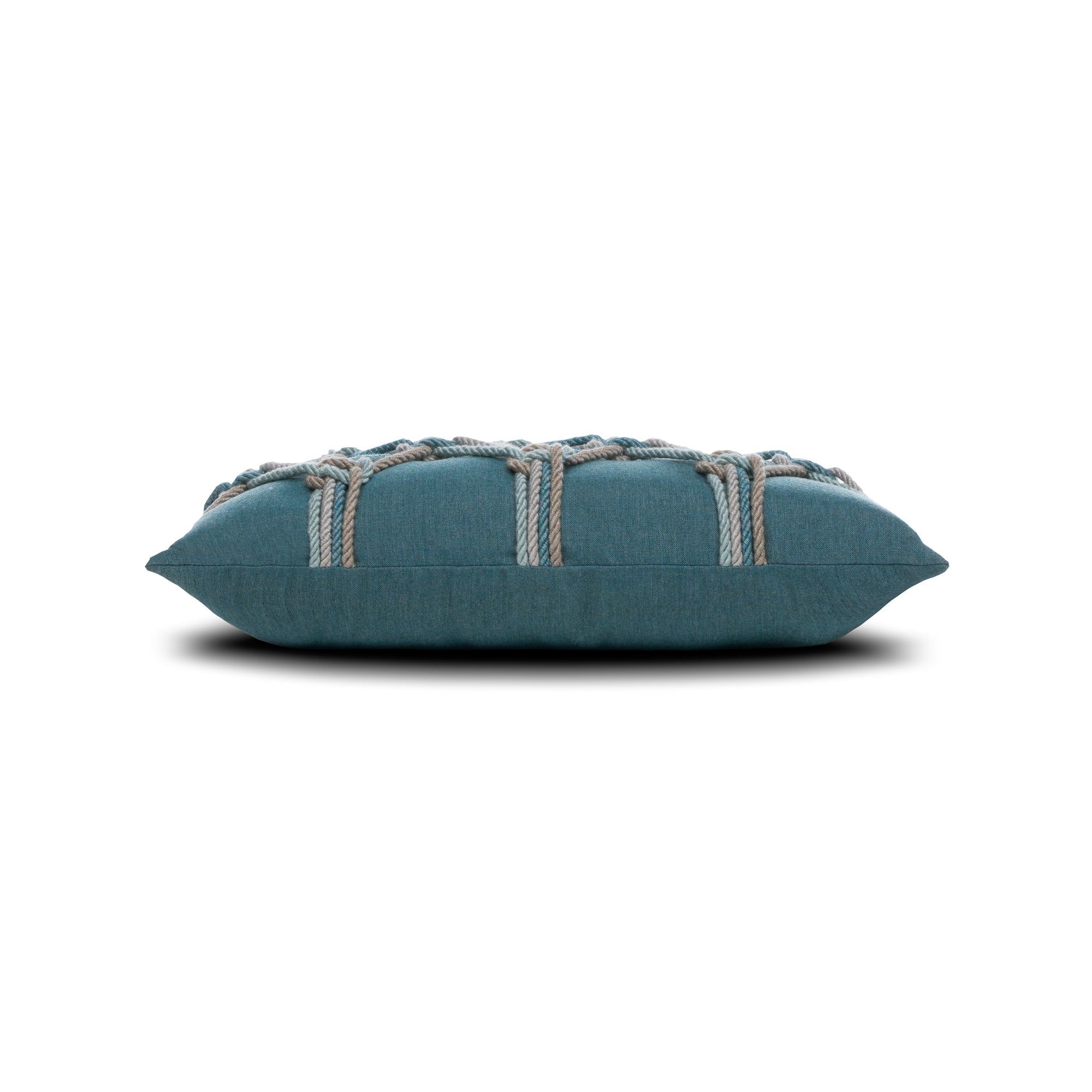 Side image of Teal geometric outdoor pillow with rope detailing in lumbar size for stylish patio decor