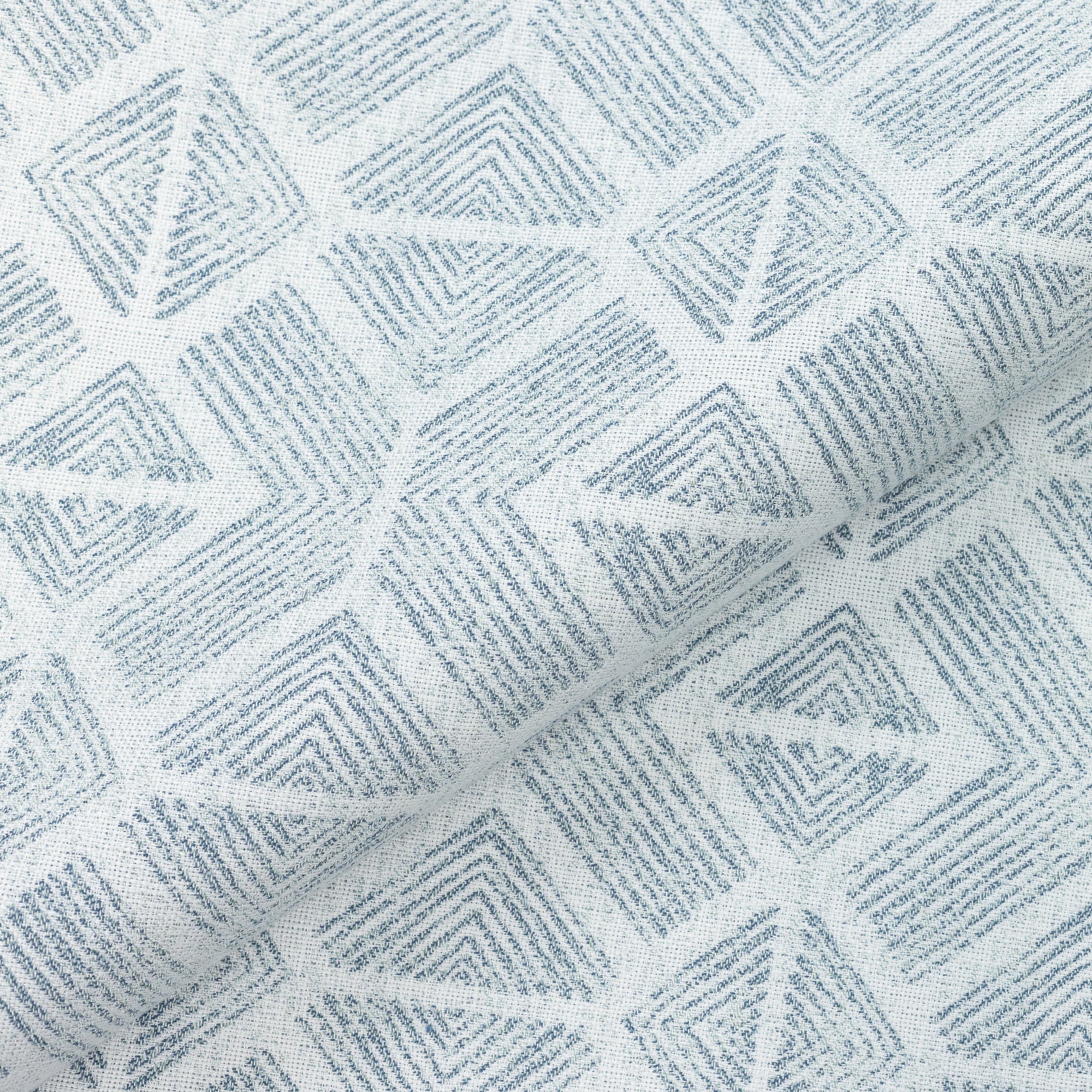 Close shot texture image of Textured outdoor safe fabric featuring geometric tribal patterns in stream blue - Bakuba Stream by Elaine Smith