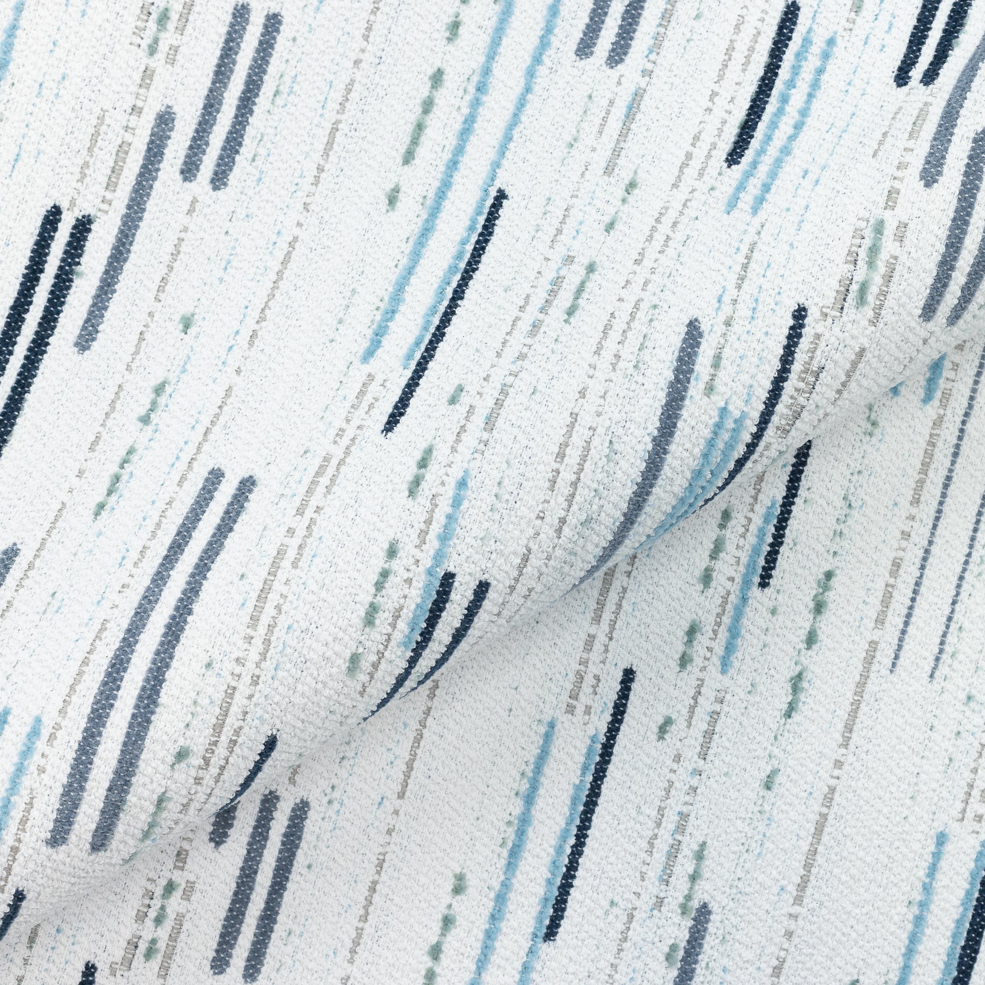 Close shot texture image of Contemporary ocean blue and white outdoor safe boucle and chenille fabric with broken line patterns – Connection Ocean by Elaine Smith