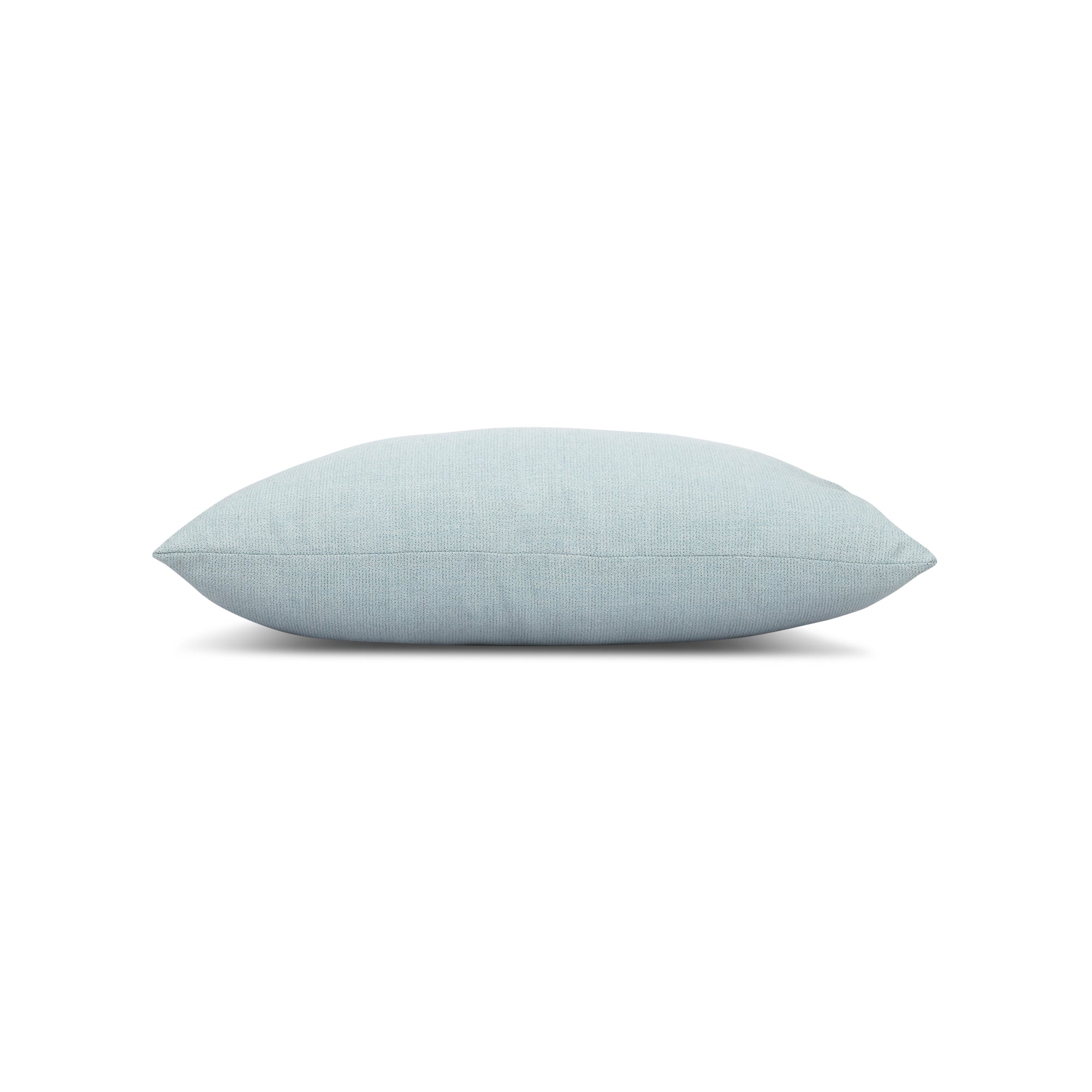 Side image of Blue solid pillow lumbar size for versatile indoor and outdoor decor