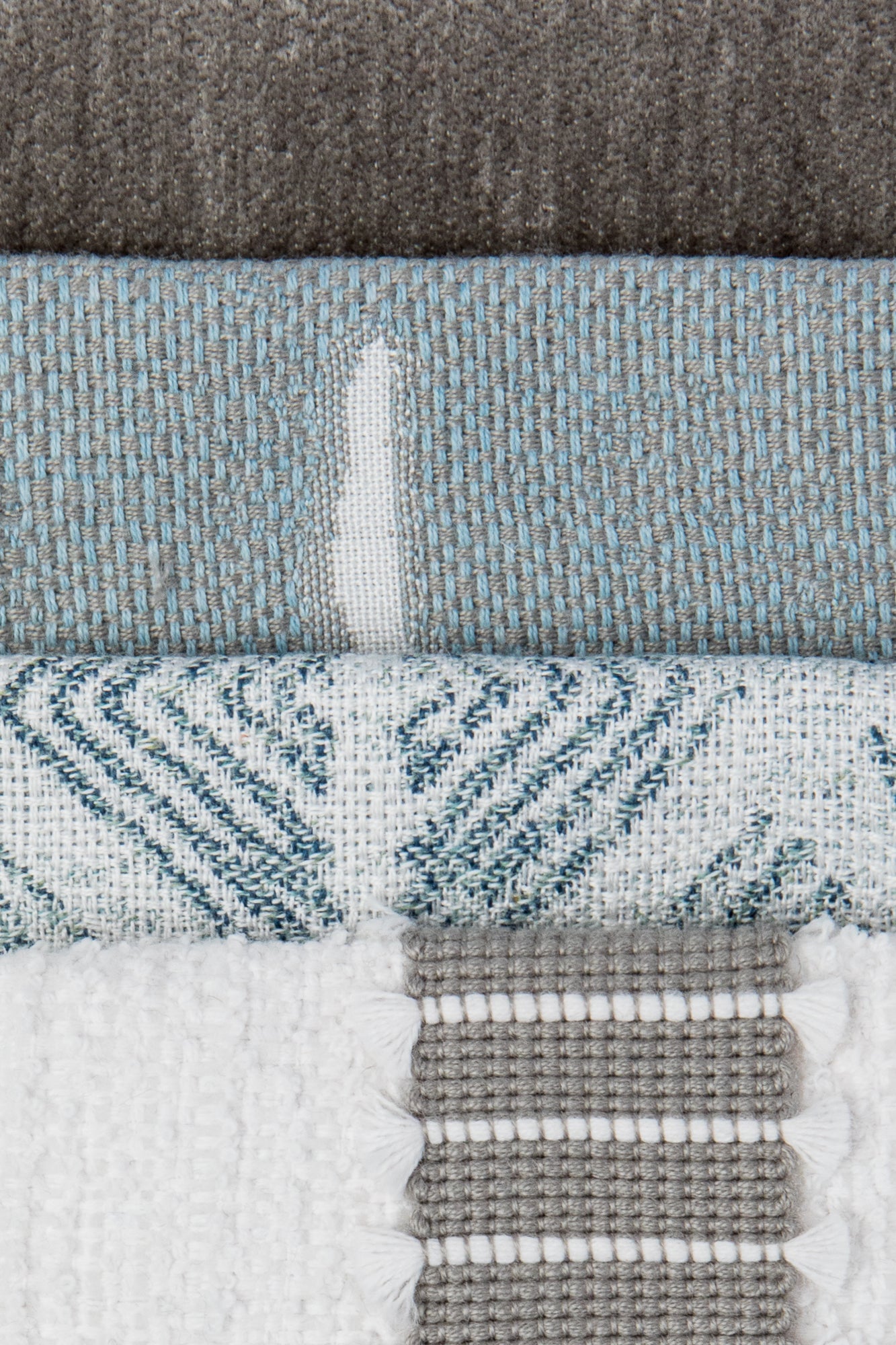 Coordinating fabrics to Textured outdoor safe fabric featuring geometric tribal patterns in stream blue - Bakuba Stream by Elaine Smith