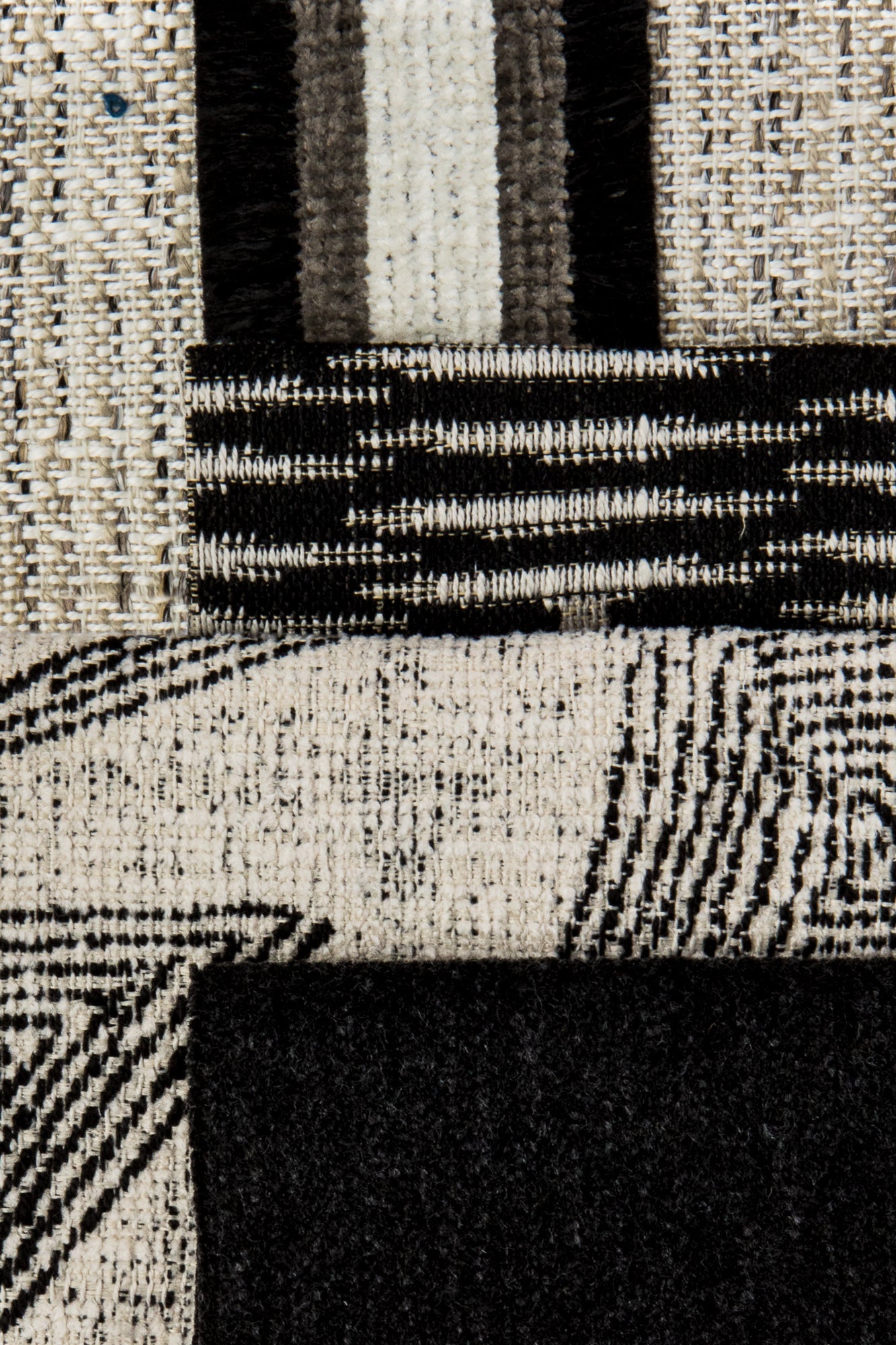 Coordinating fabrics to Ebony-toned geometric outdoor safe fabric with tribal-inspired design