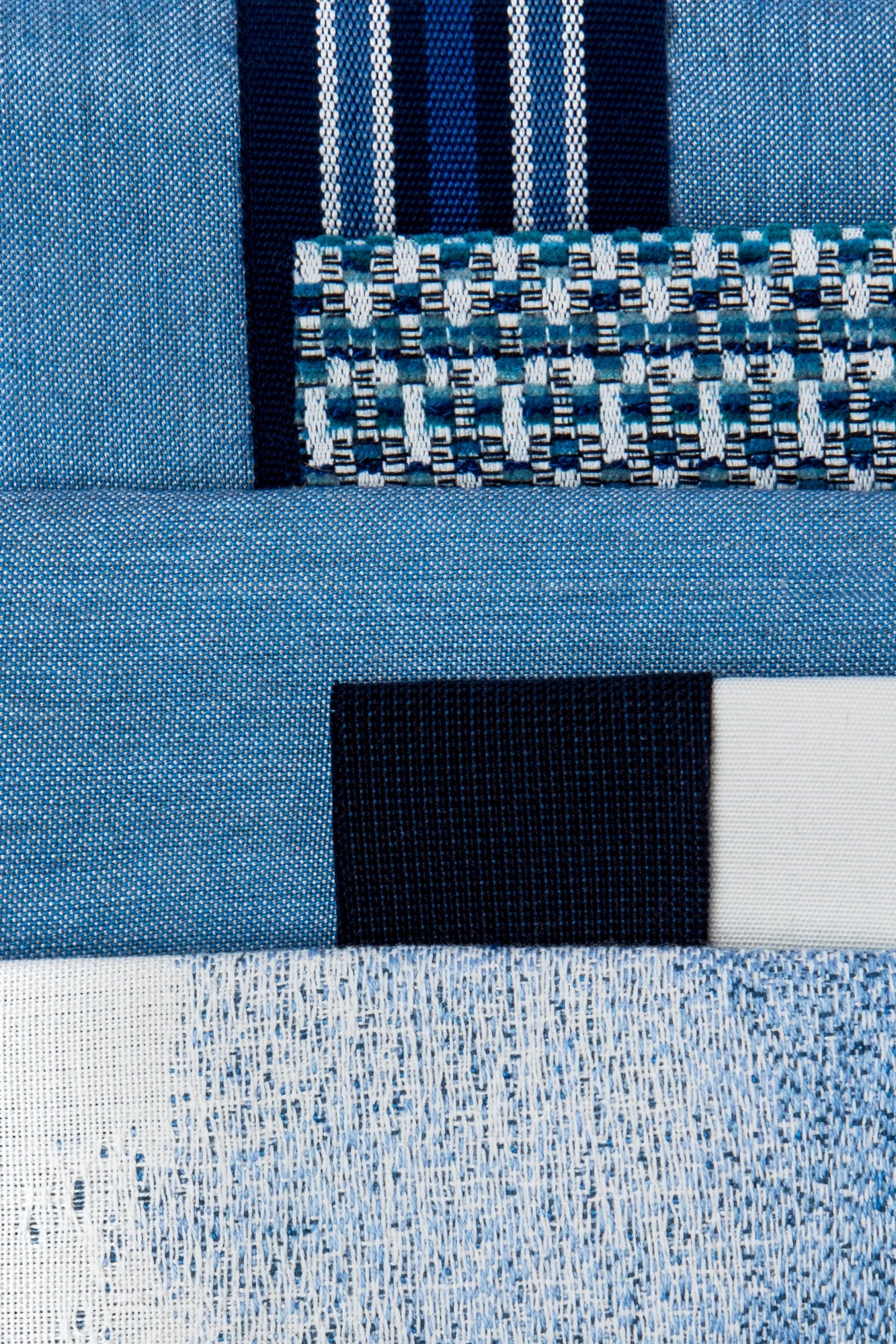Coordinating fabrics to Indigo-colored multi-colored chenille kaleidoscope design in performance outdoor safe fabric