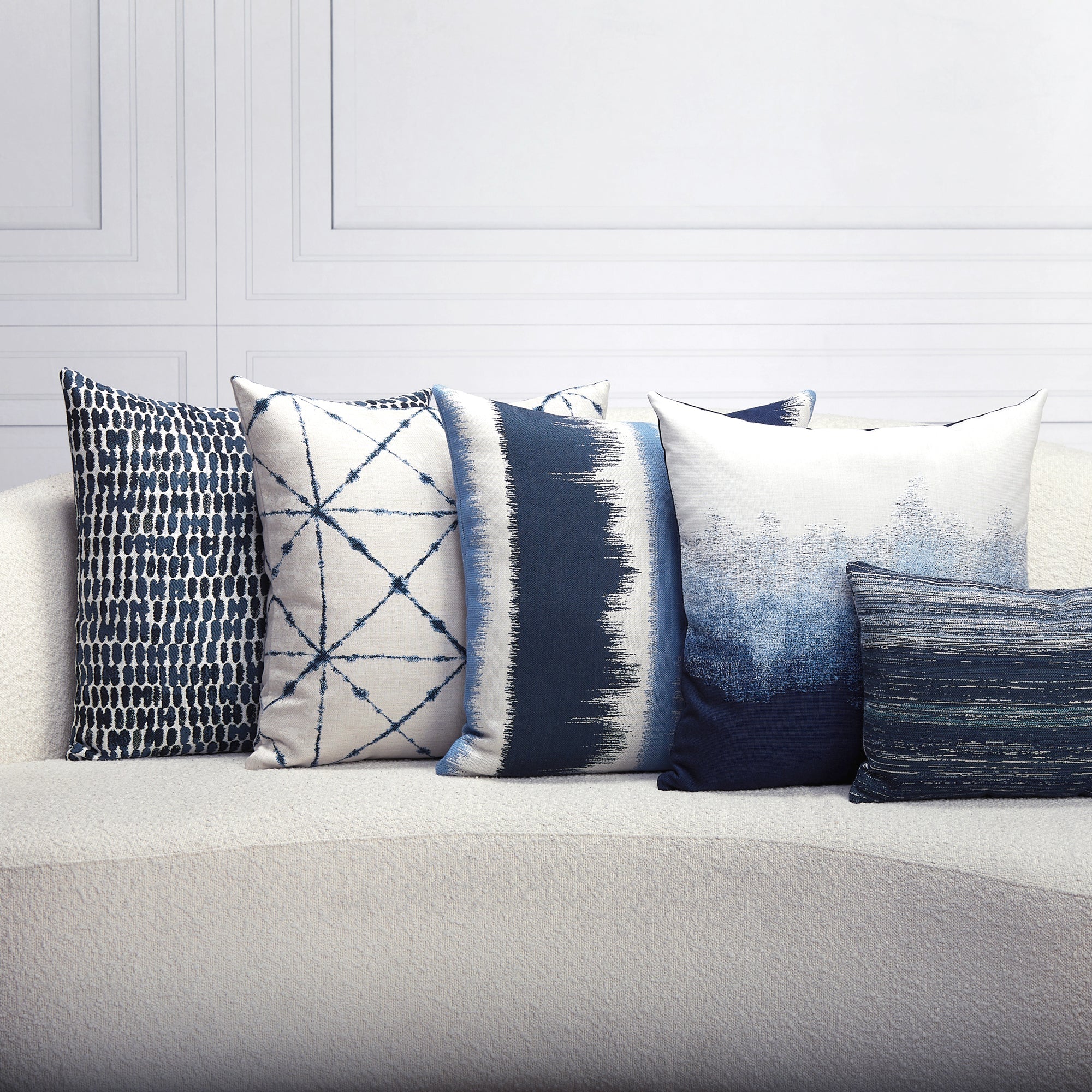 Indoor environmental image of pillows in Gradient outdoor-safe fabric in midnight blues and soft white – Murmur Midnight by Elaine Smith