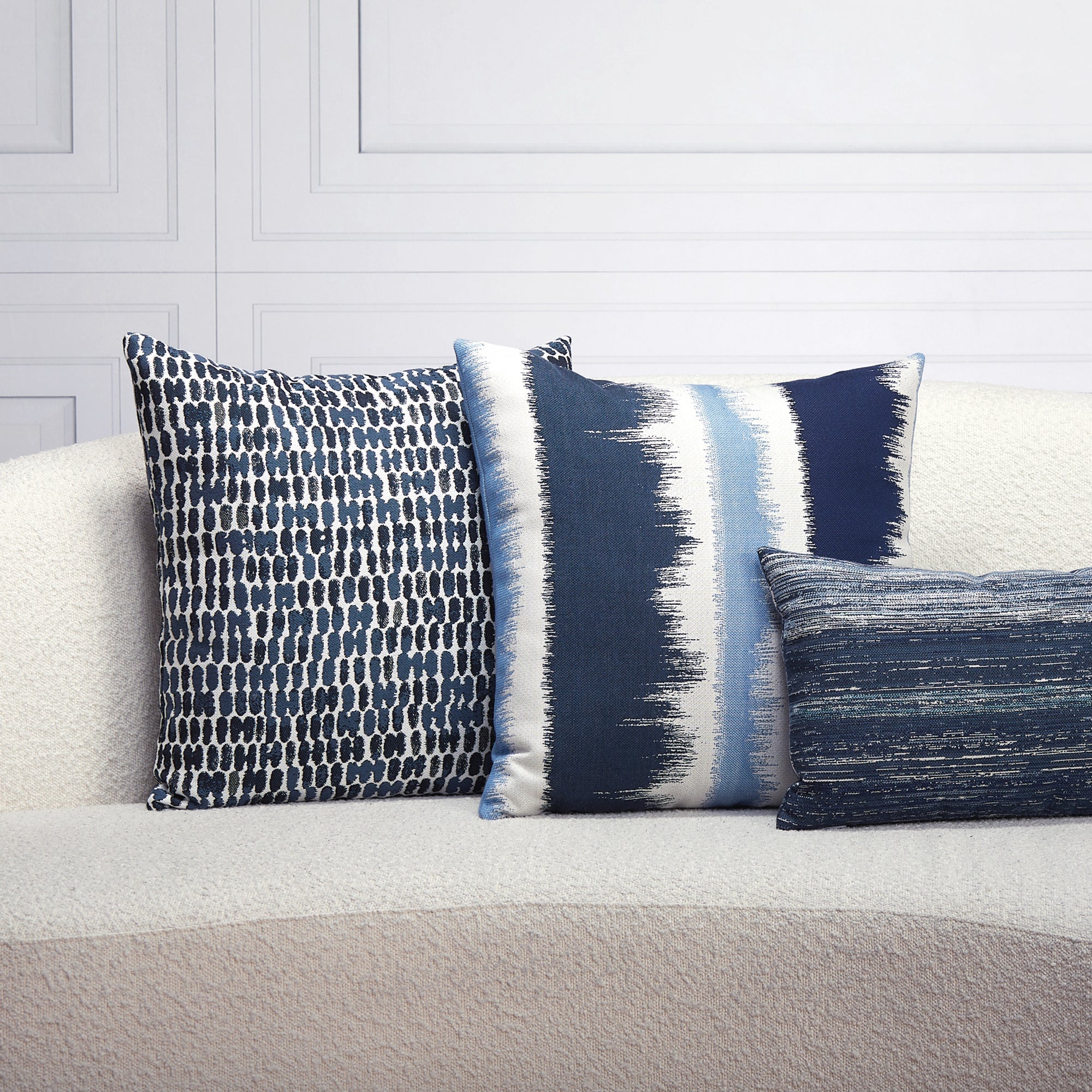 Indoor environmental image of pillows in Trilogy Indigo – outdoor-safe woven fabric by Elaine Smith, ideal for high-end commercial and residential applications.