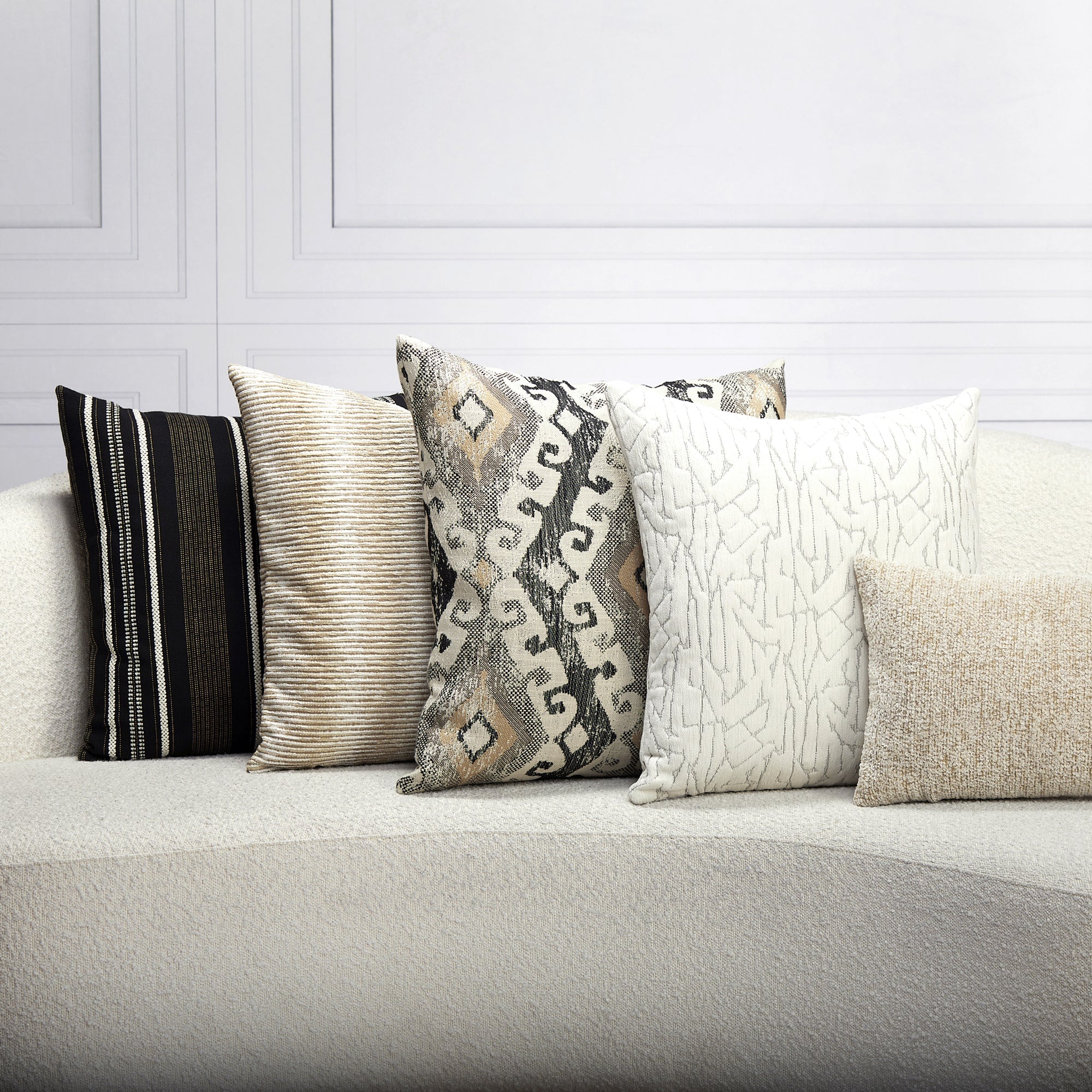 Indoor environmental image of pillows in Decorative honey-toned outdoor-safe fabric with ethnic-inspired motif