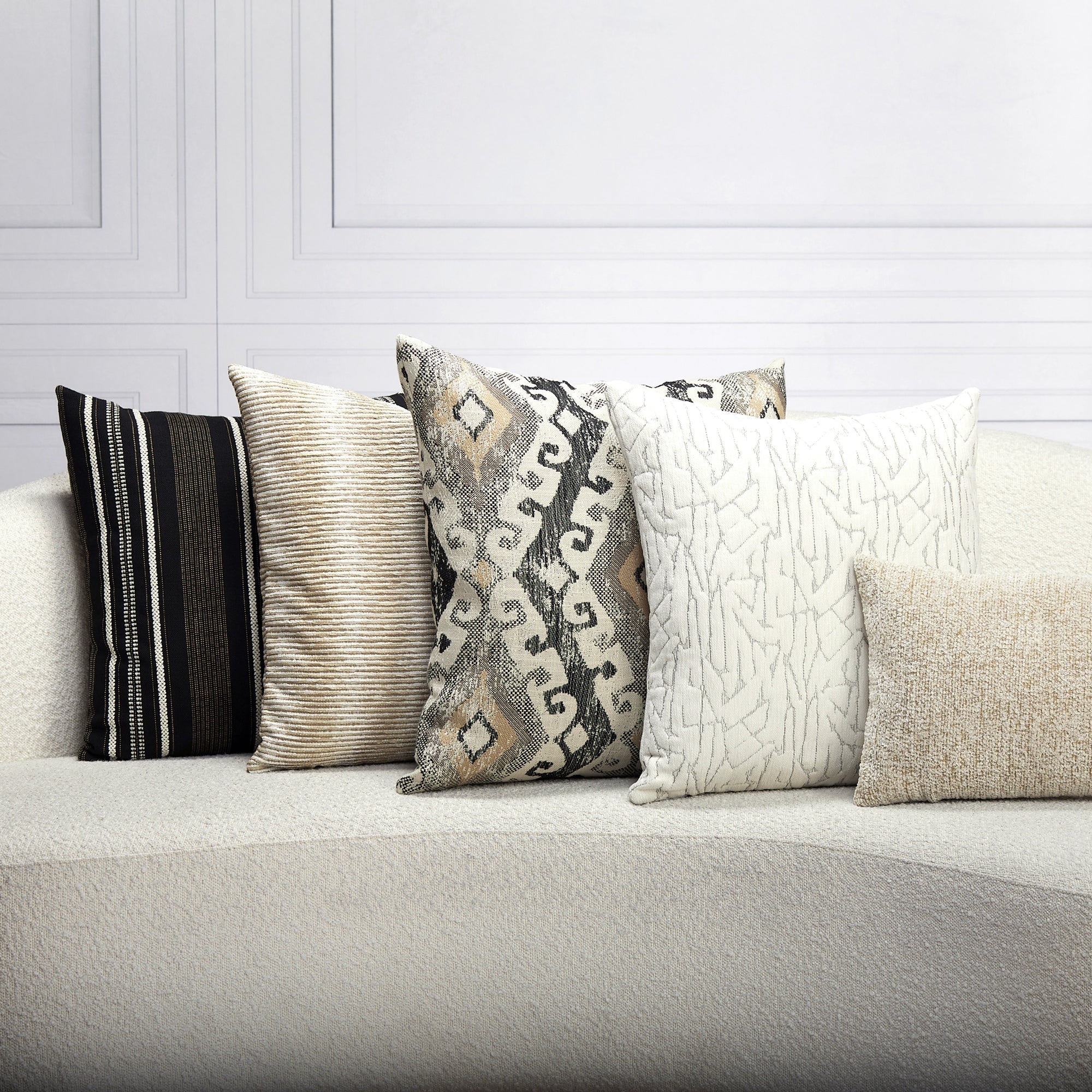 Indoor environmental image of pillows in Decorative honey-toned outdoor-safe fabric with ethnic-inspired motif