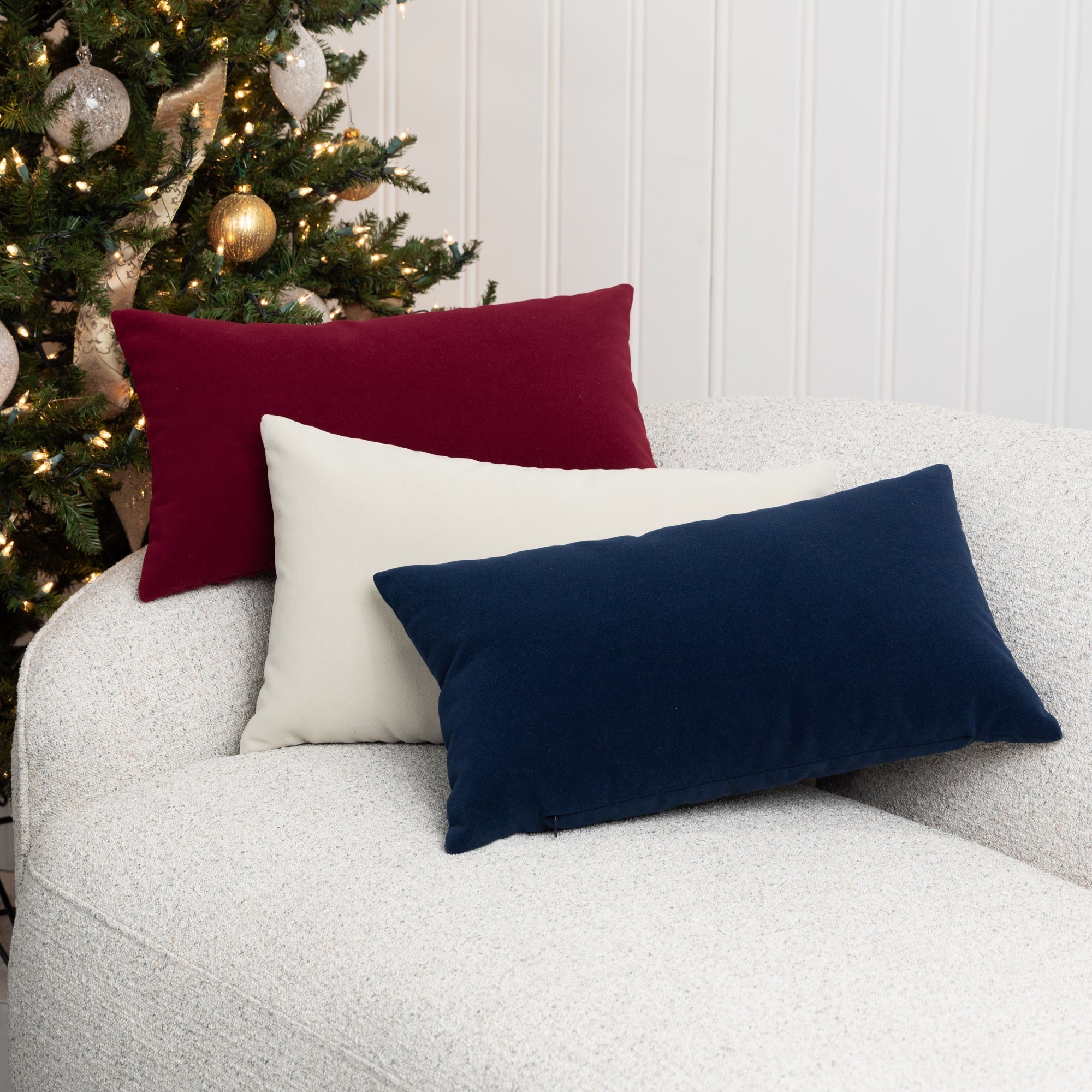 Indoor environmental image of lumbar velvet pillows in various colors by elaine smith