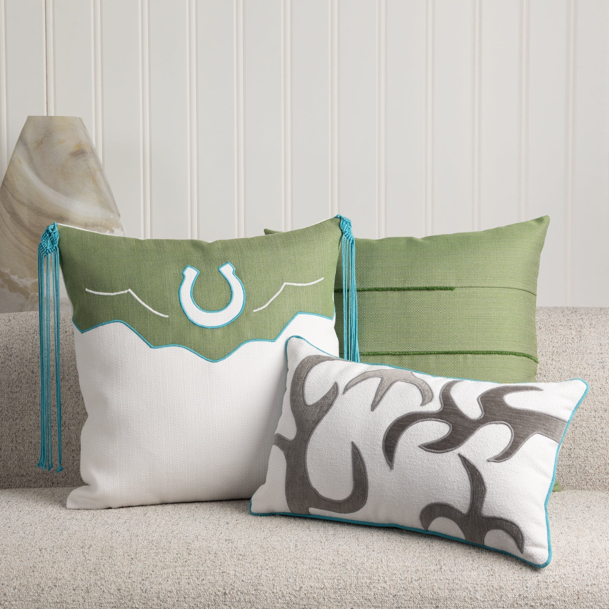 Indoor environmental image of pillows in Bright chalk white outdoor safe woven textile with fine weave