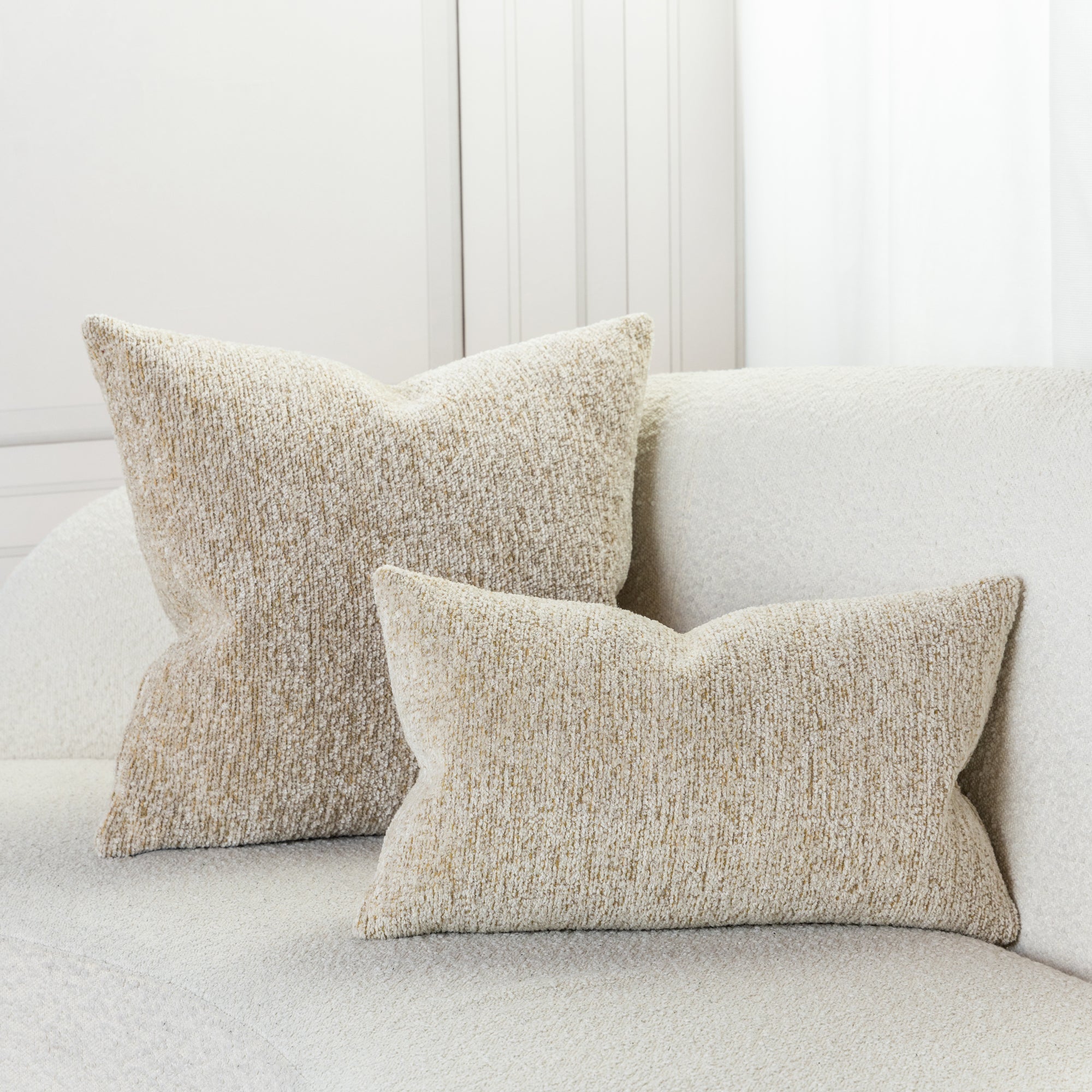 Indoor environmental image of pillows in Soft honey-colored woven texture chenille outdoor safe fabric