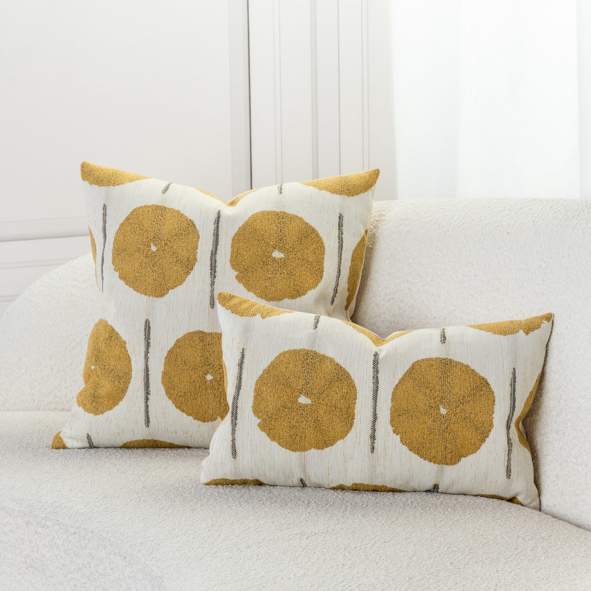 Geometric pillow in gold and ivory in ivory sofa by elaine smith