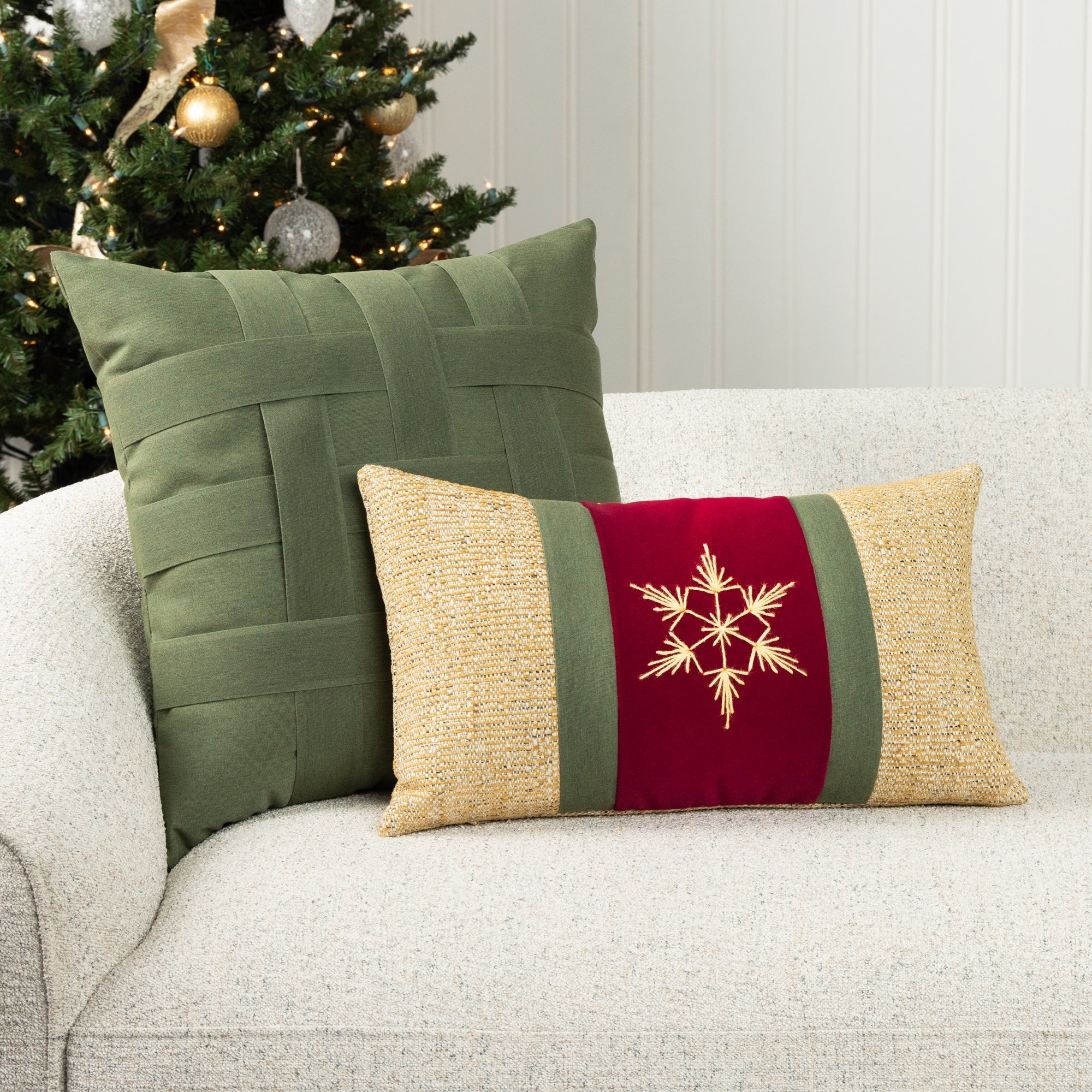 Luxury holiday image of lumbar pillow in ruby and gold with square basketweave pillow in green