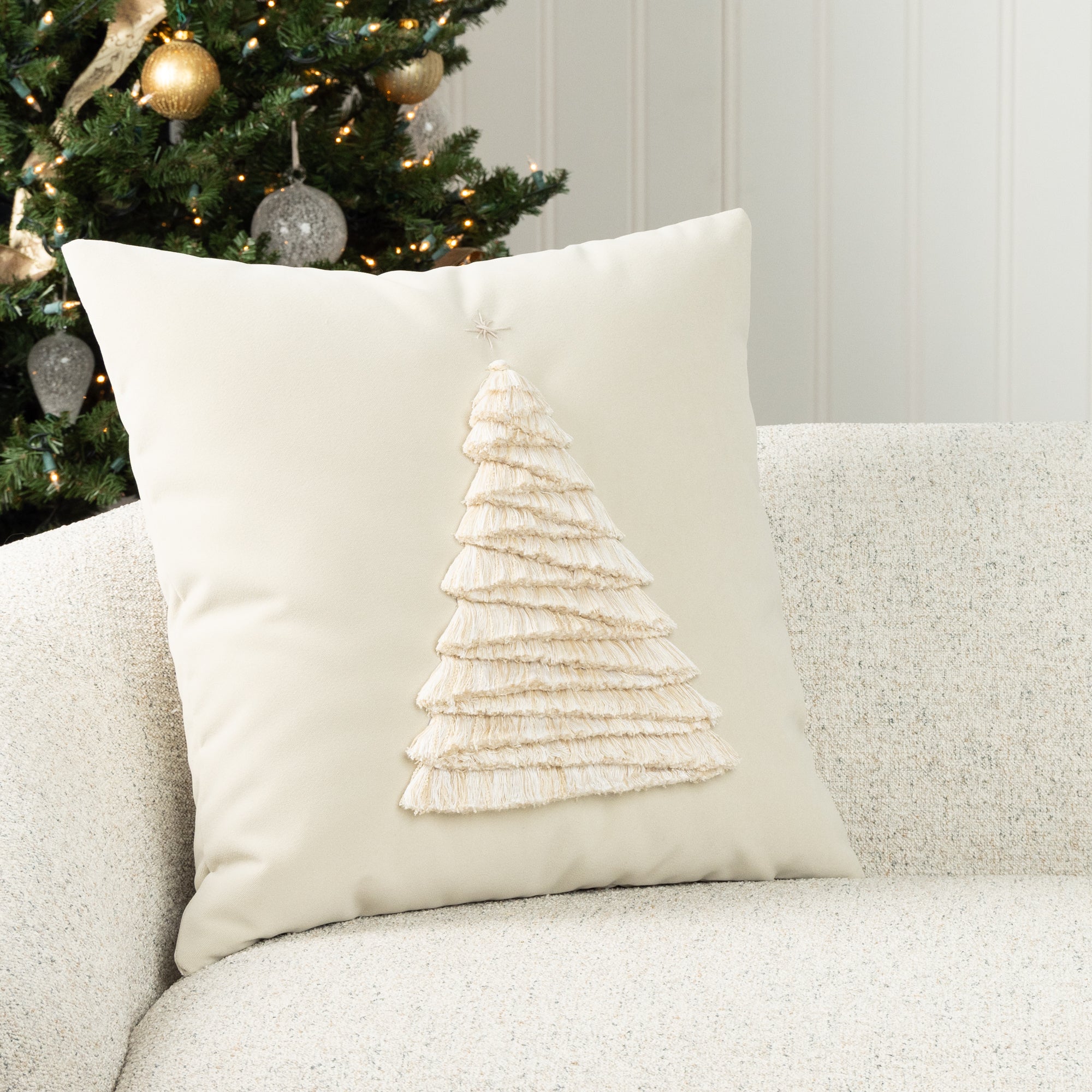 Luxury holiday image of ivory holiday accent pillow with hand stitched holiday tree accents, outdoor safe by elaine smith