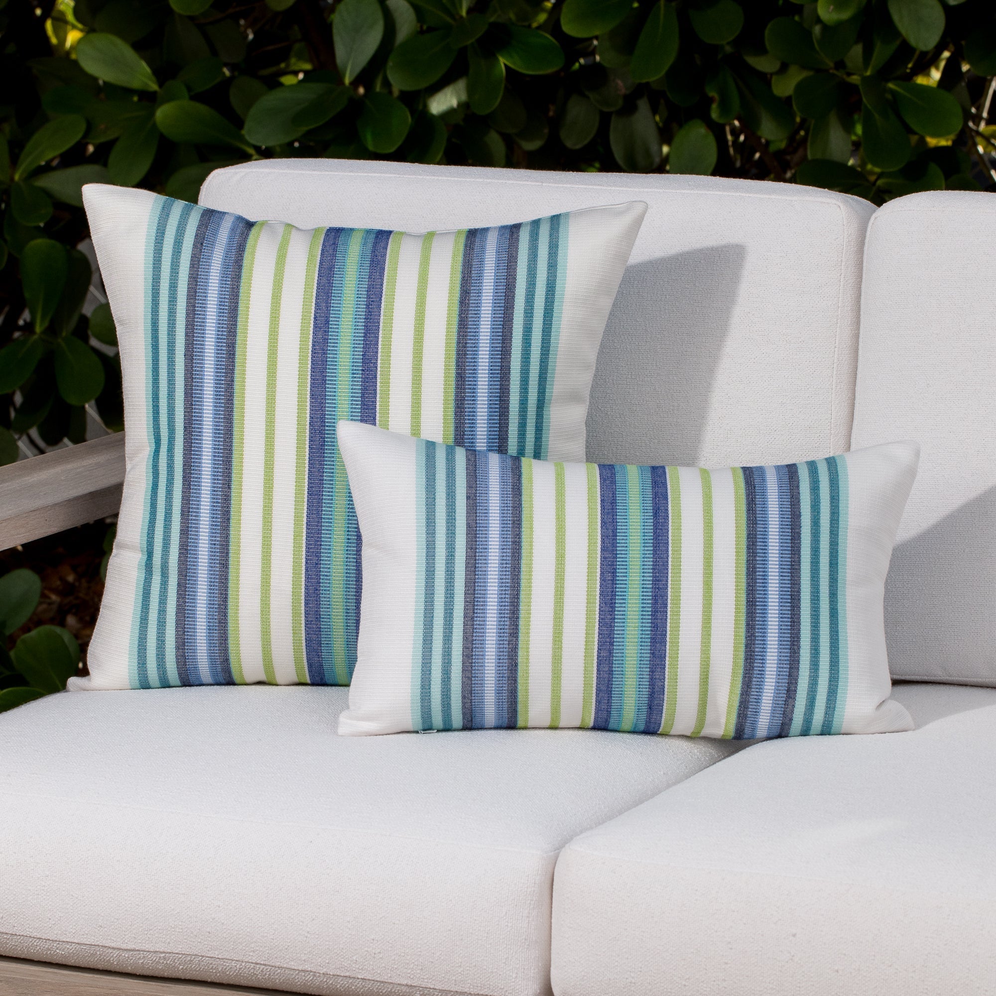 Outdoor image of pillows in Contemporary oval patterned outdoor safe fabric in blue and green