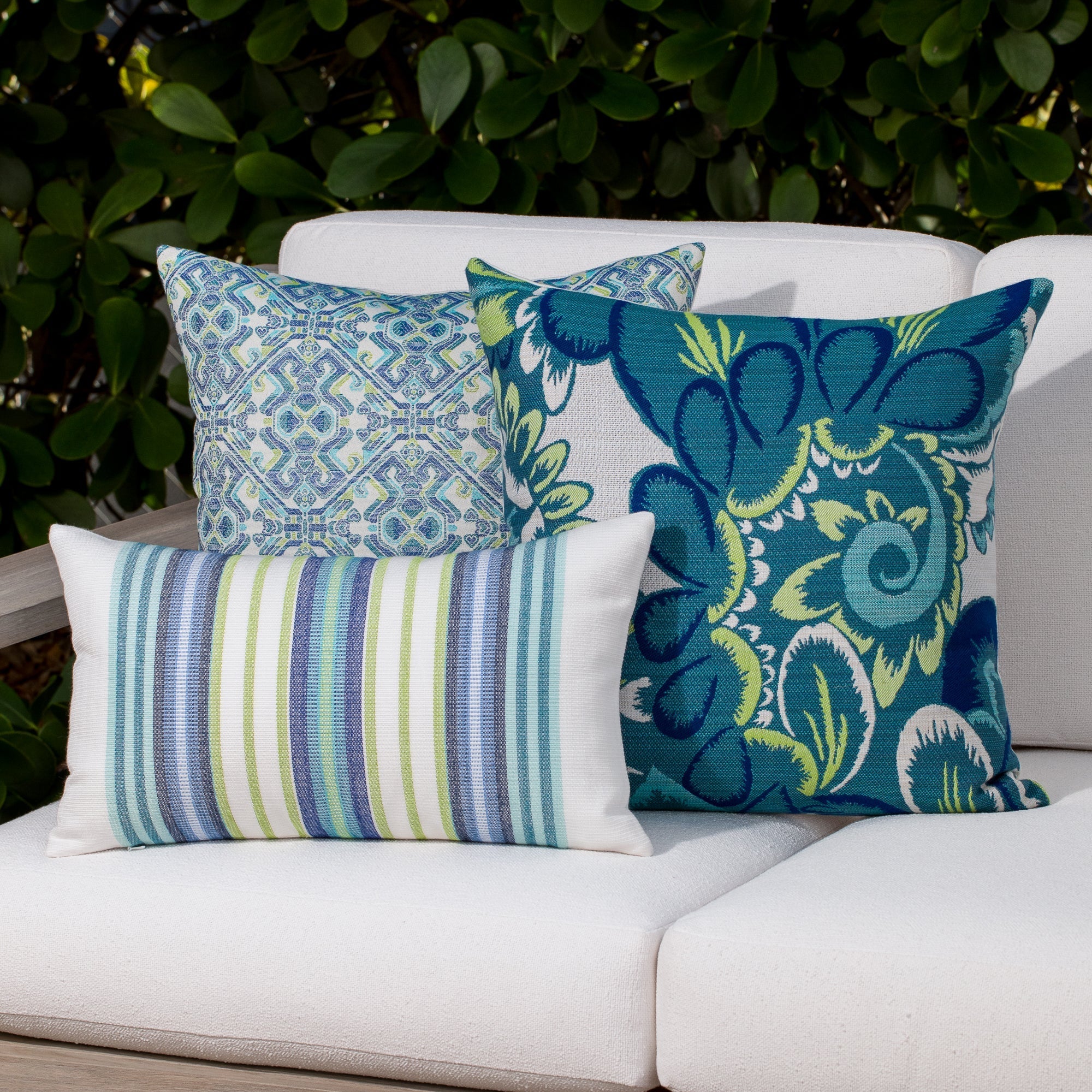 Outdoor image of pillows in Contemporary oval patterned outdoor safe fabric in blue and green