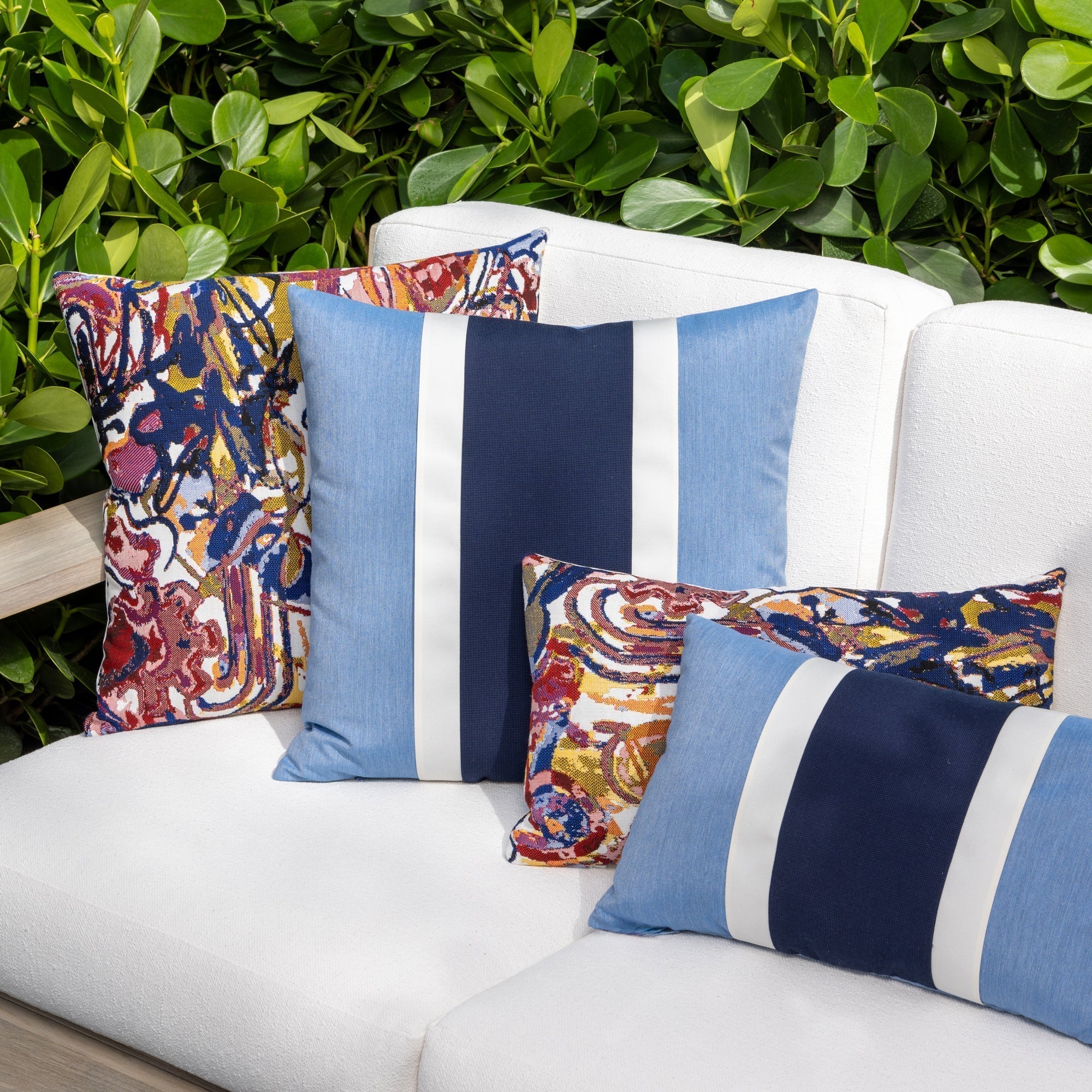 Outdoor image of pillows in Graffiti – outdoor-safe woven fabric by Elaine Smith, ideal for high-end commercial and residential applications.