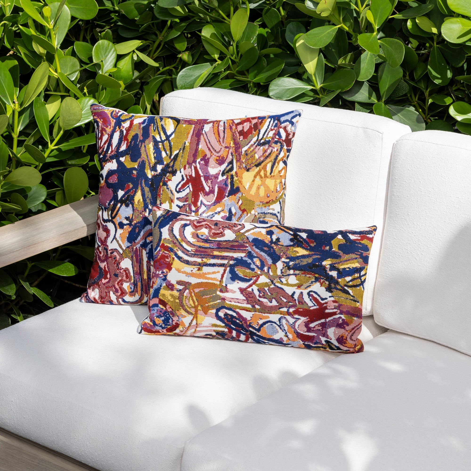 Outdoor image of pillows in Classic navy solid outdoor-safe woven fabric